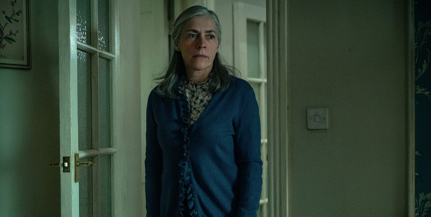 Saskia Reeves as Catherine Standish standing in the doorway on Slow Horses season 5.
