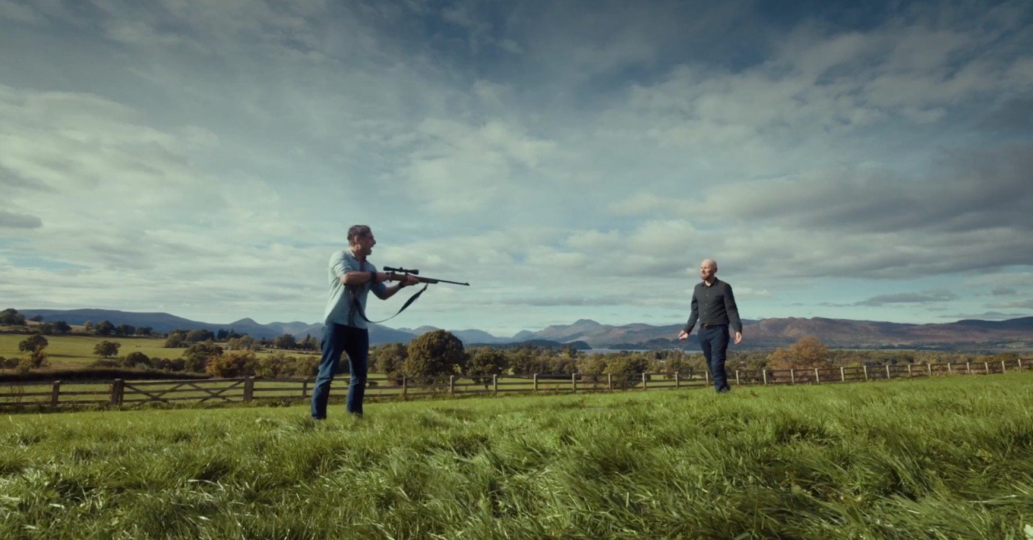John pointing a gun at Tommy in Coldwater