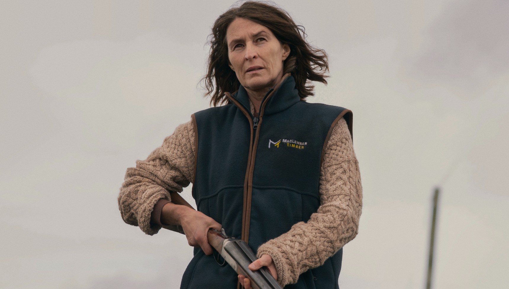 Helen Baxendale holding a gun in The Dark