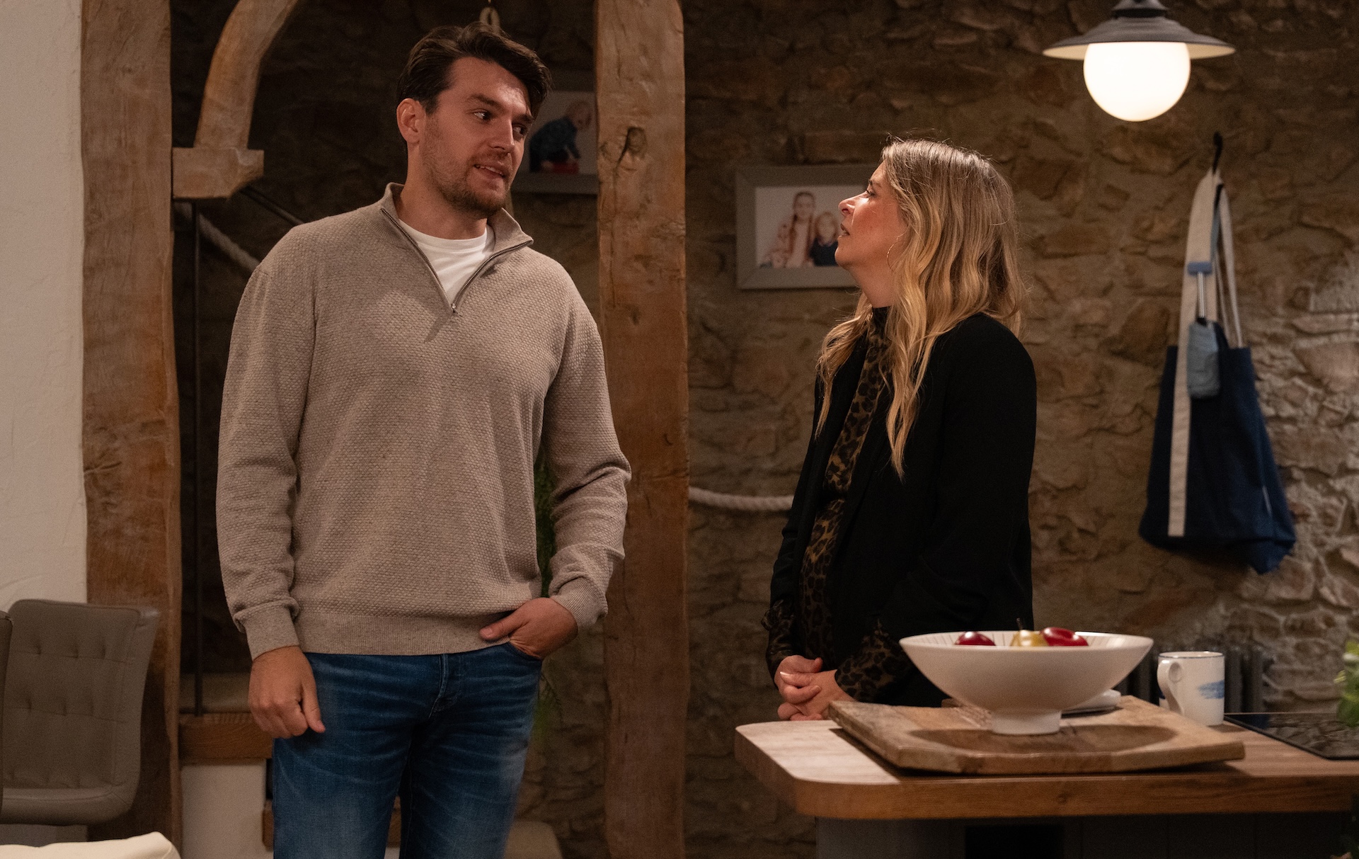 Charity and Mack look at one another in Emmerdale