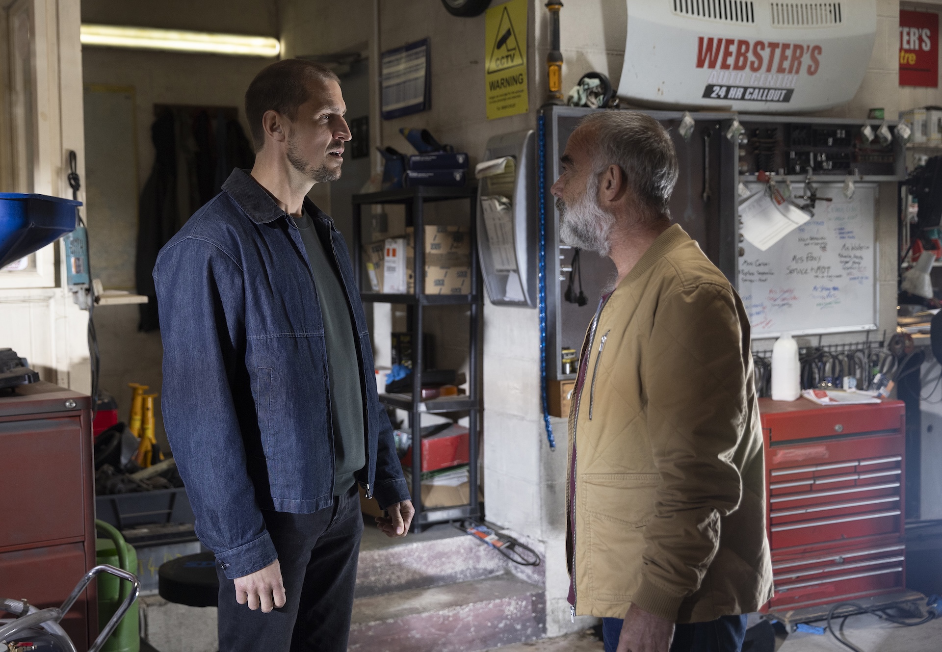 Coronation Street's Carl and Kevin squaring up to each other in the garage