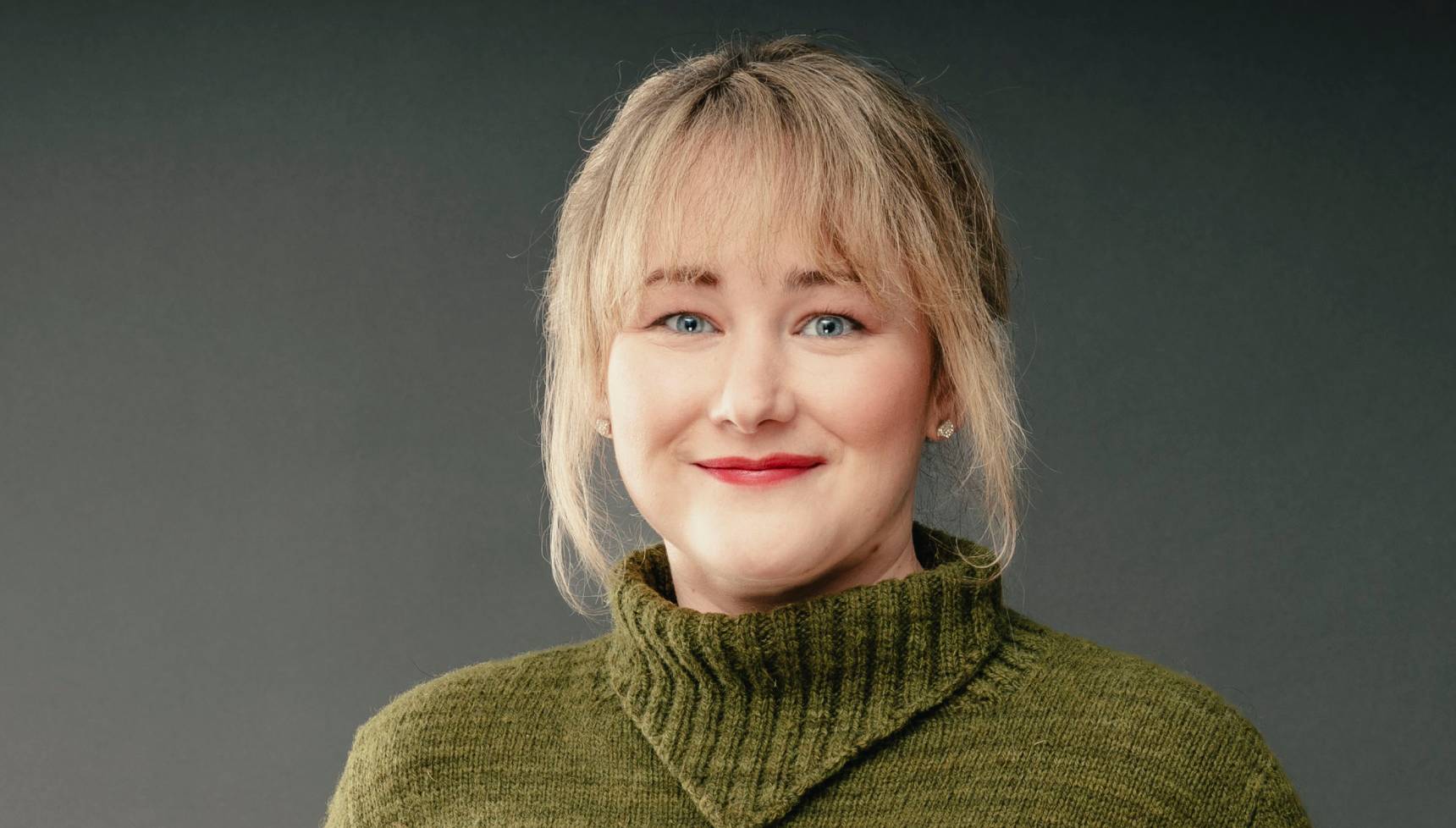 Contestant Ailsa wearing a green knitted top