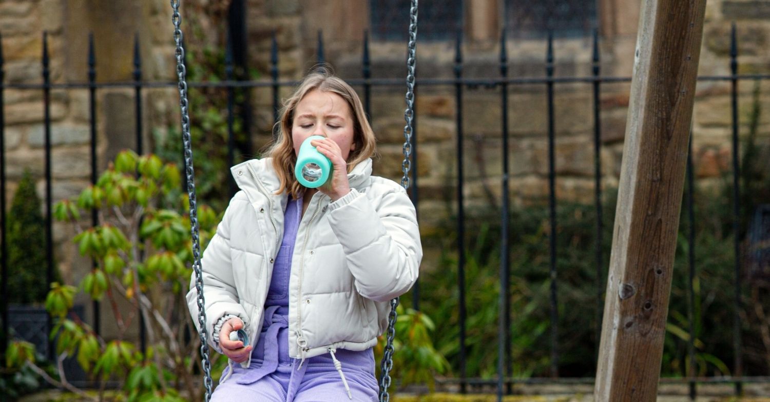 Liv drinking in Emmerdale