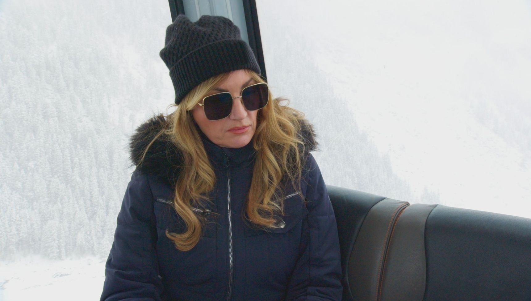 Karren Brady sits in a wintry setting