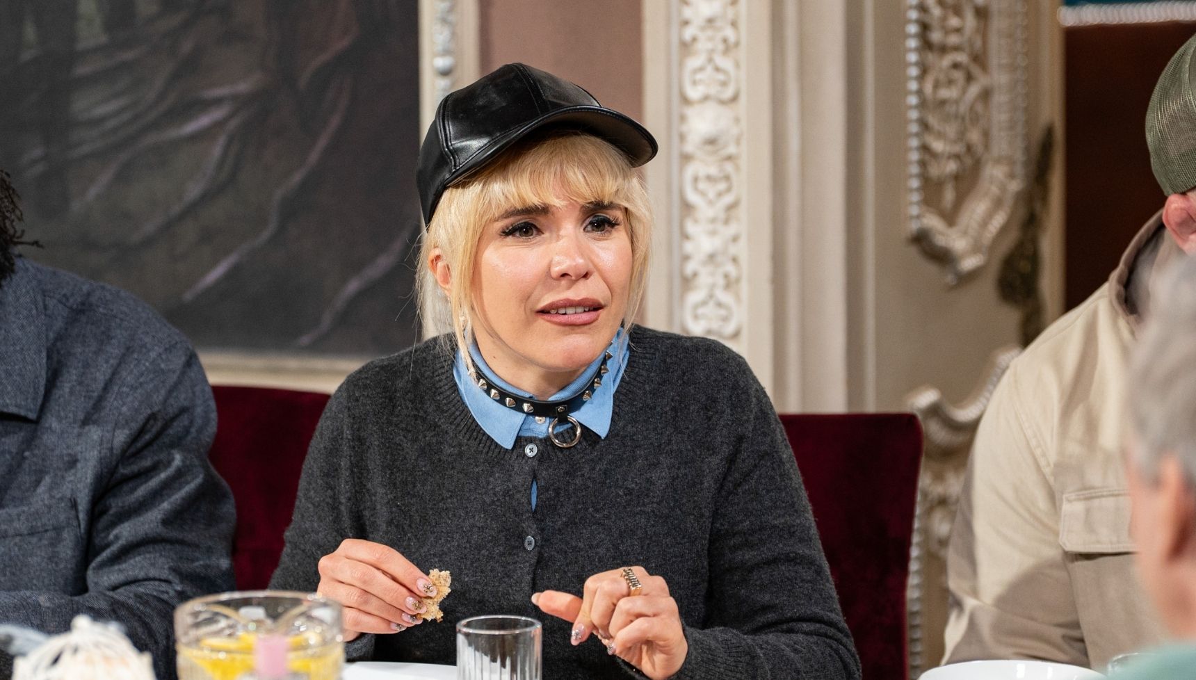 Paloma Faith in black hat and cardigan