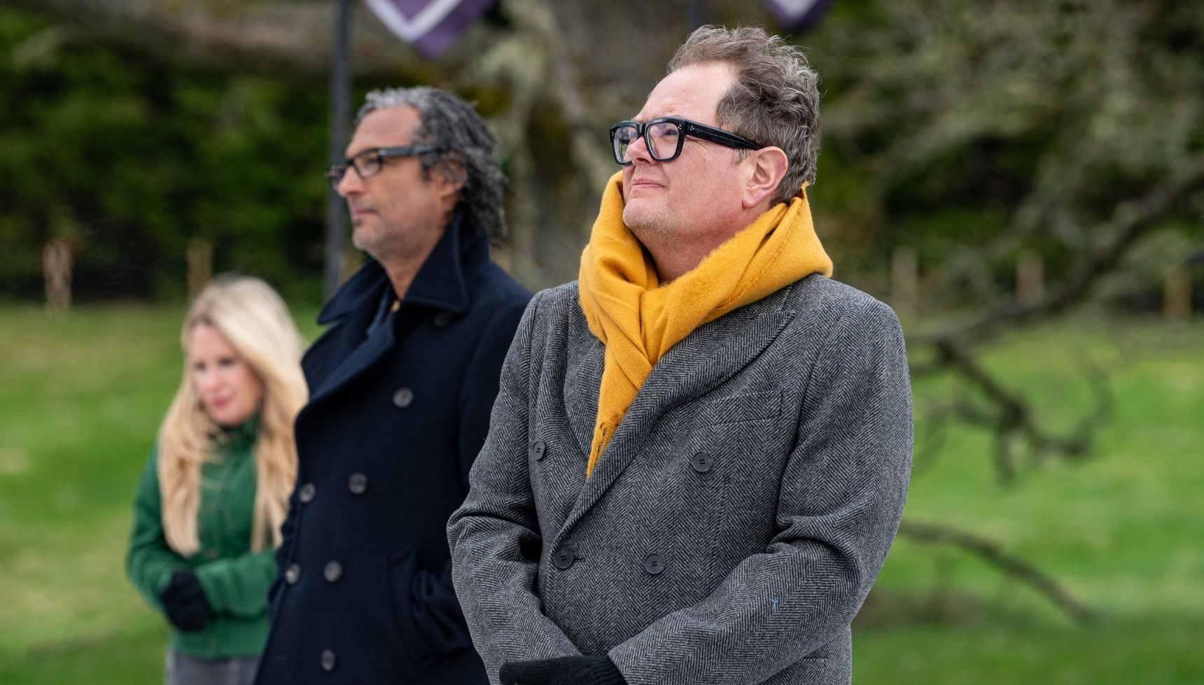 Alan Carr in a coat on Celebrity Traitors