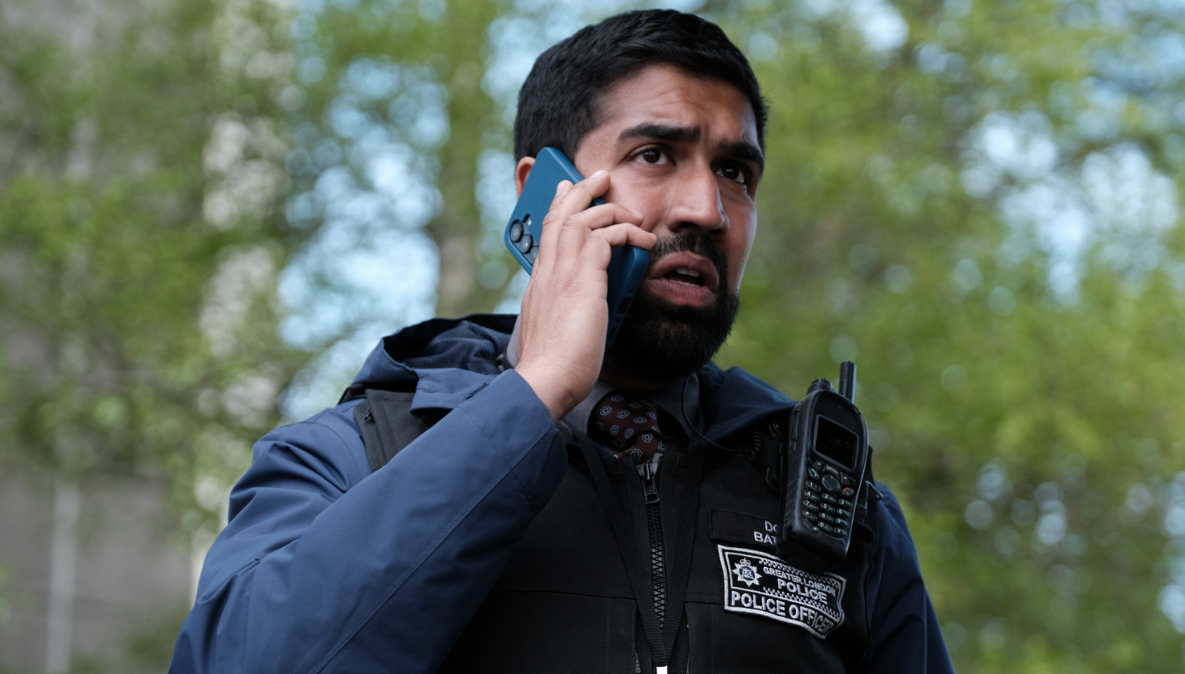 A close up of Maanuv Thiara on the phone in Trigger Point season 3