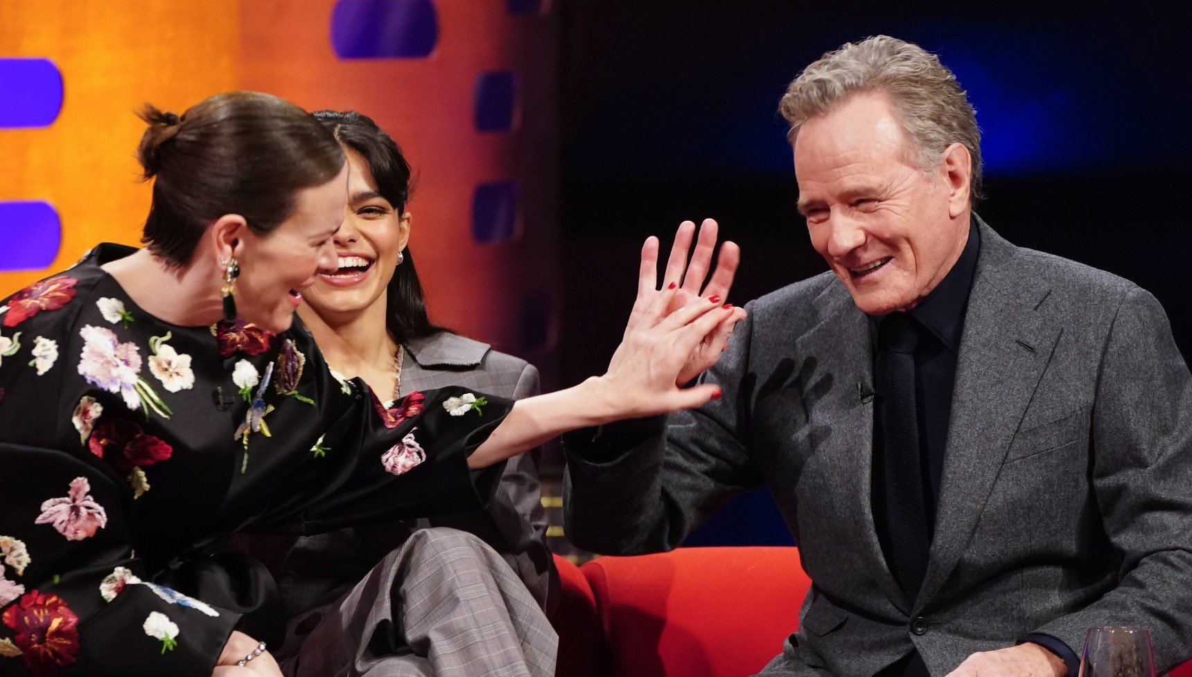 A man and a woman high-fiving each other