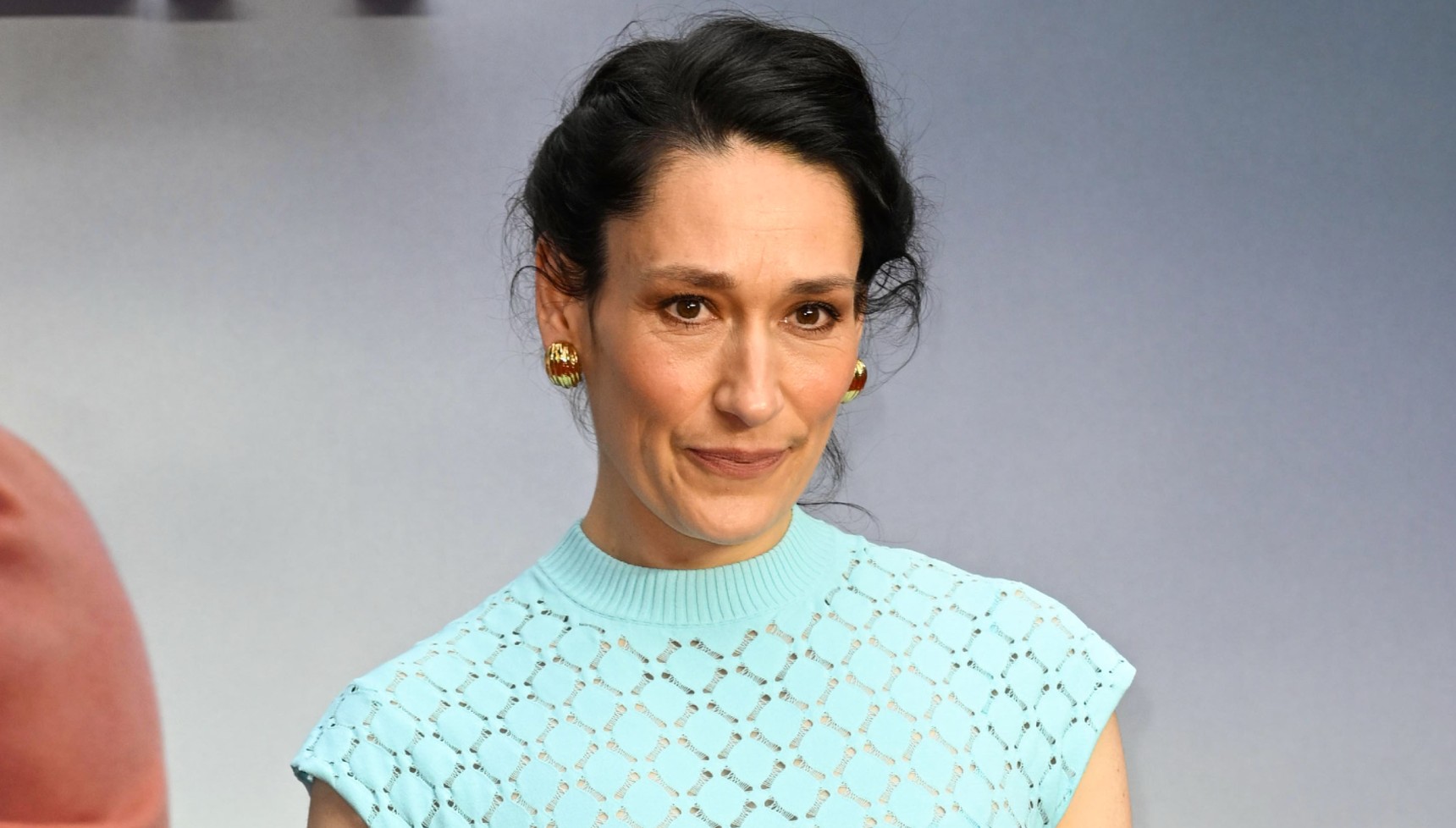 Sian Clifford in a blue dress