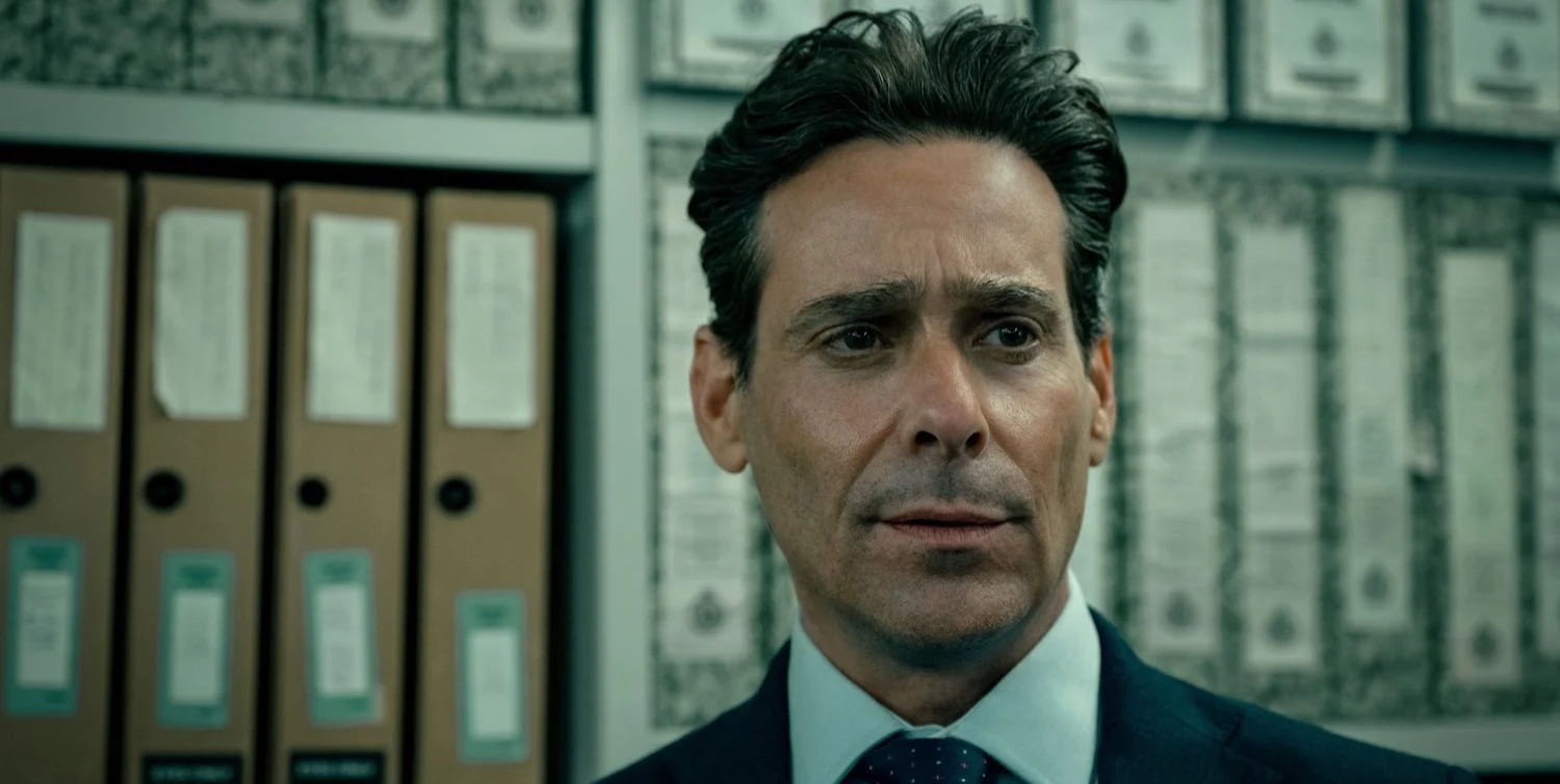 Close up of James Callis as Claude Whelan in Slow Horses.