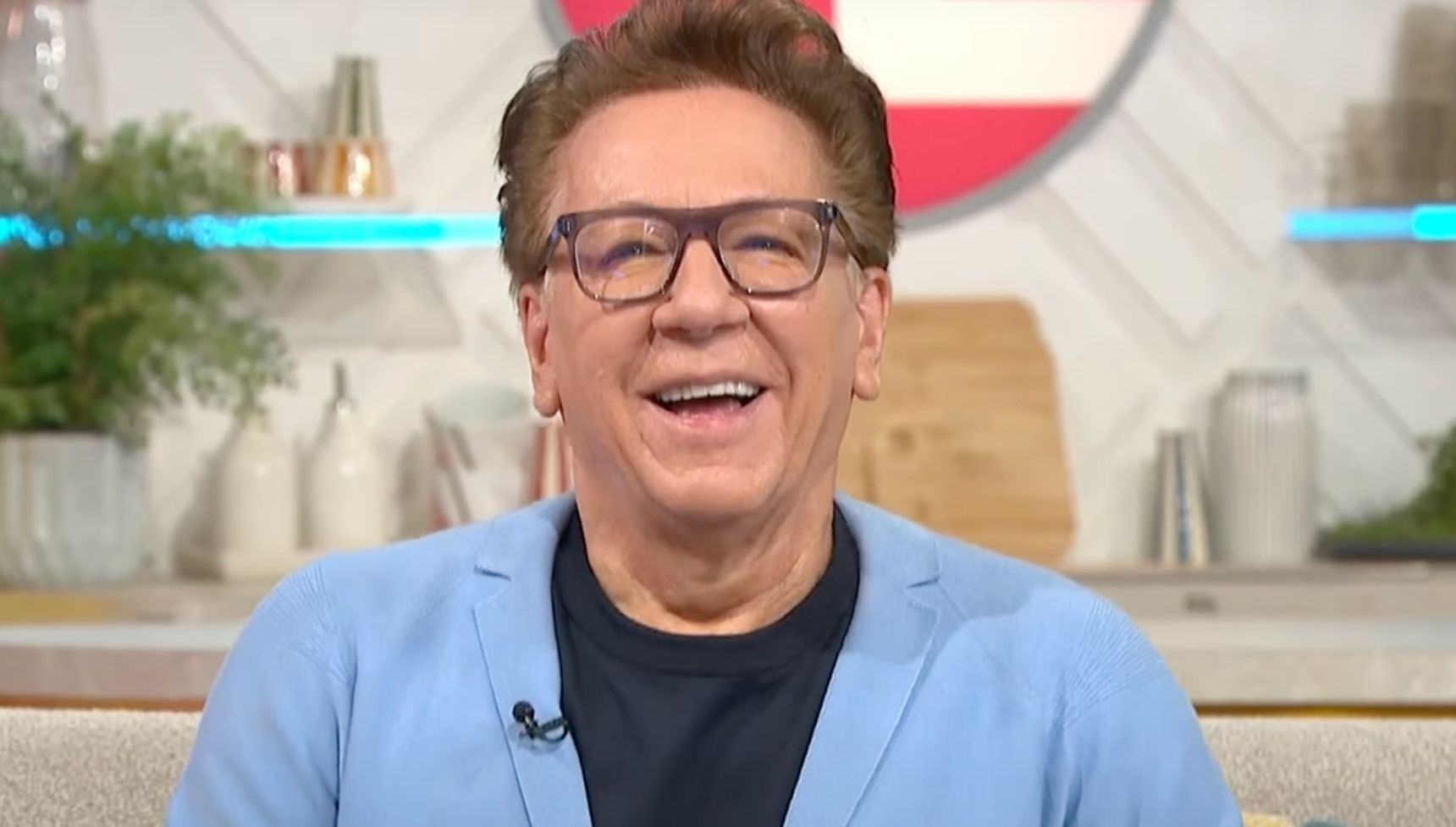 Ross King in blue jacket and glasses