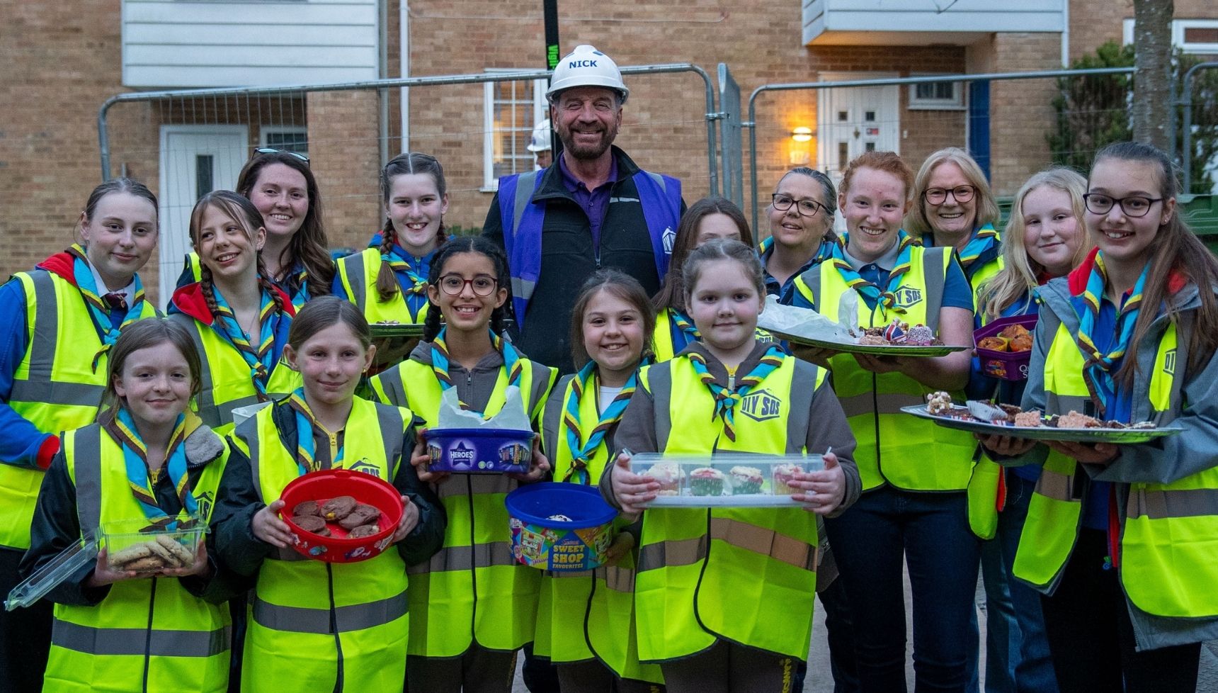 Nick Knowles with local children on DIY SOS