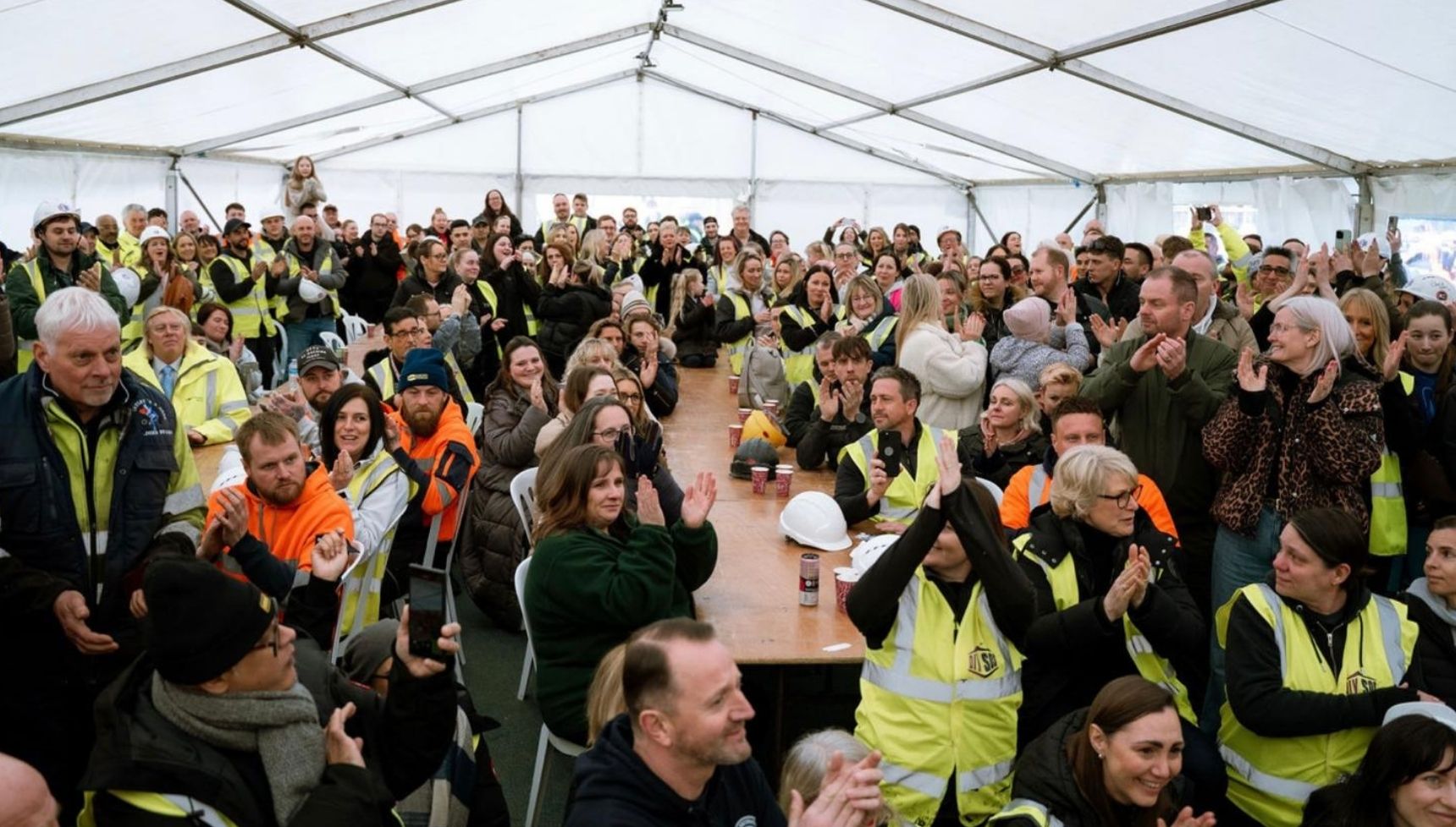 DIY SOS volunteers in a white gazebo