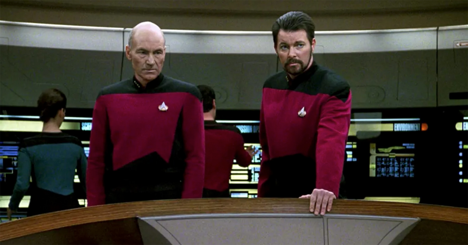Captain Jean-Luc Picard and Commander Will Riker on the Enterprise bridge in Star Trek: The Next Generation