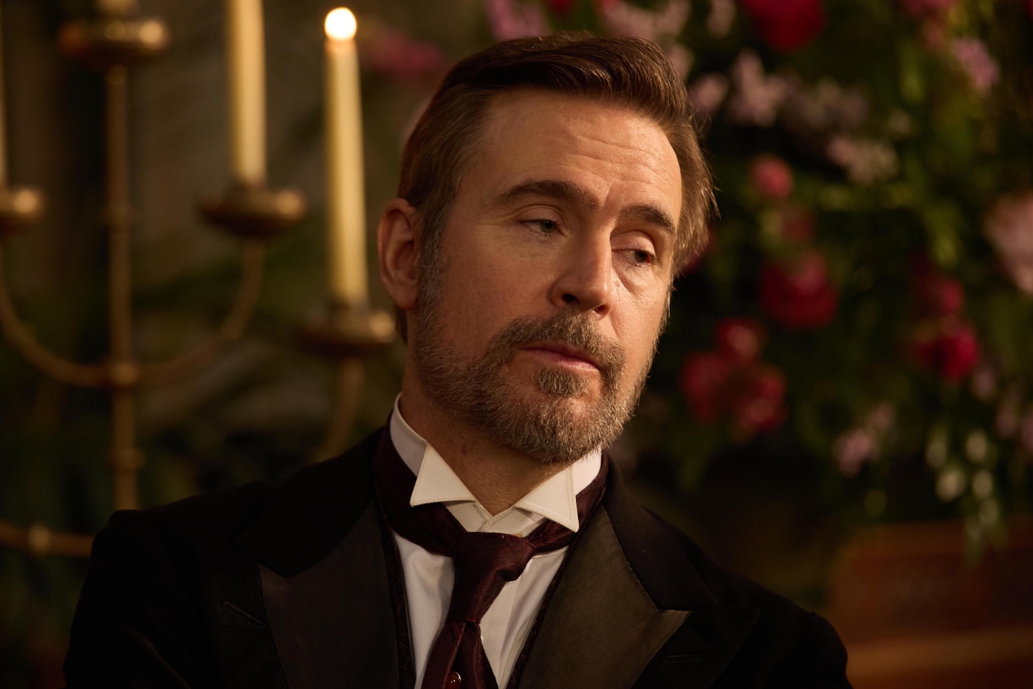 Jack Davenport as James in The Forsytes wearing a smart black suit and talking to someone off camera