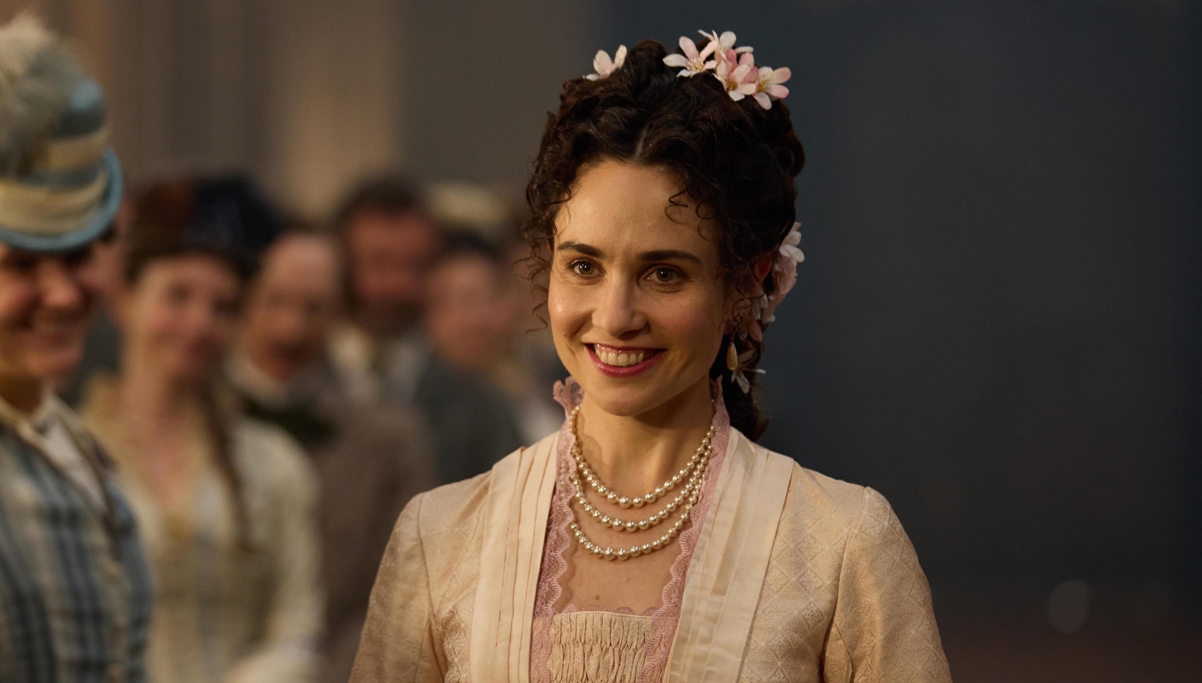 Tuppence Middleton as Frances wearing a wedding dress and walking down the aisle