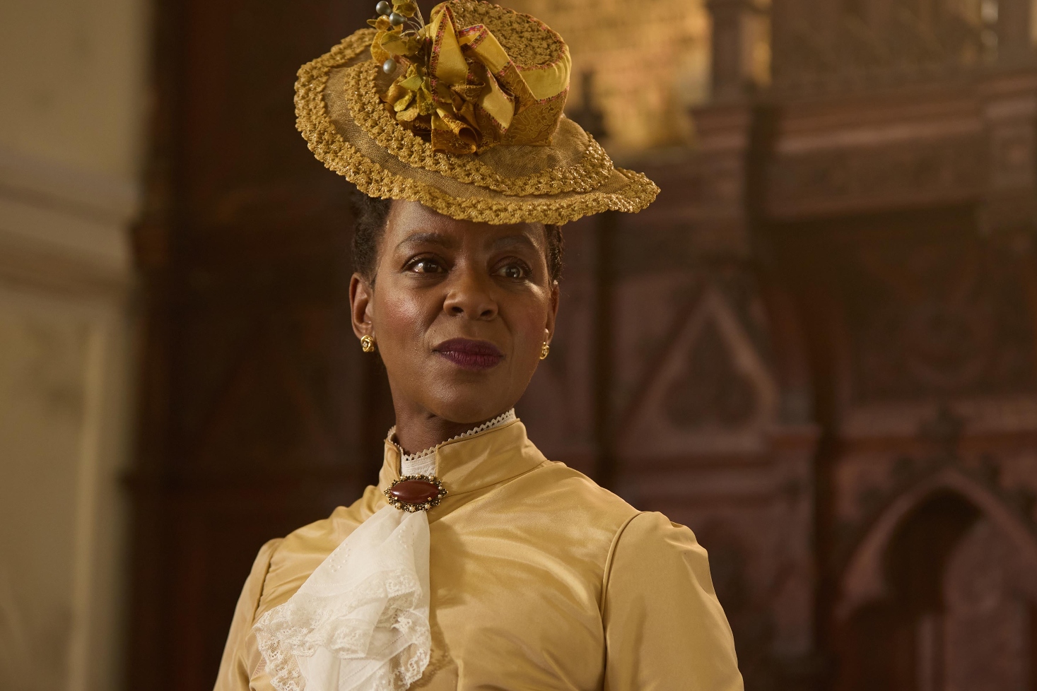 Josette Simon as Ellen in Victorian dress and an elegant hat