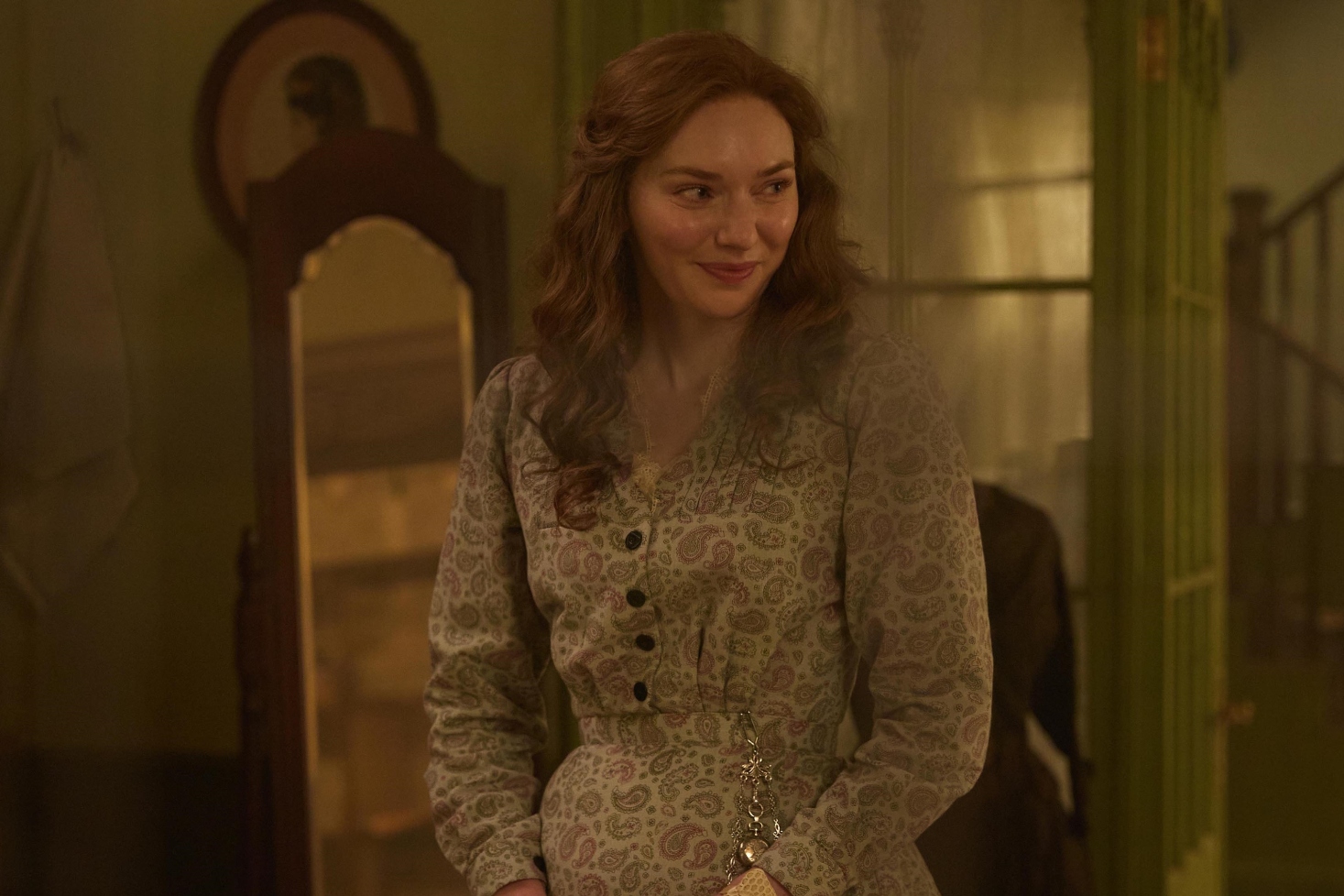 Eleanor Tomlinson as Louisa in The Forsytes cast smiling in a pale dress