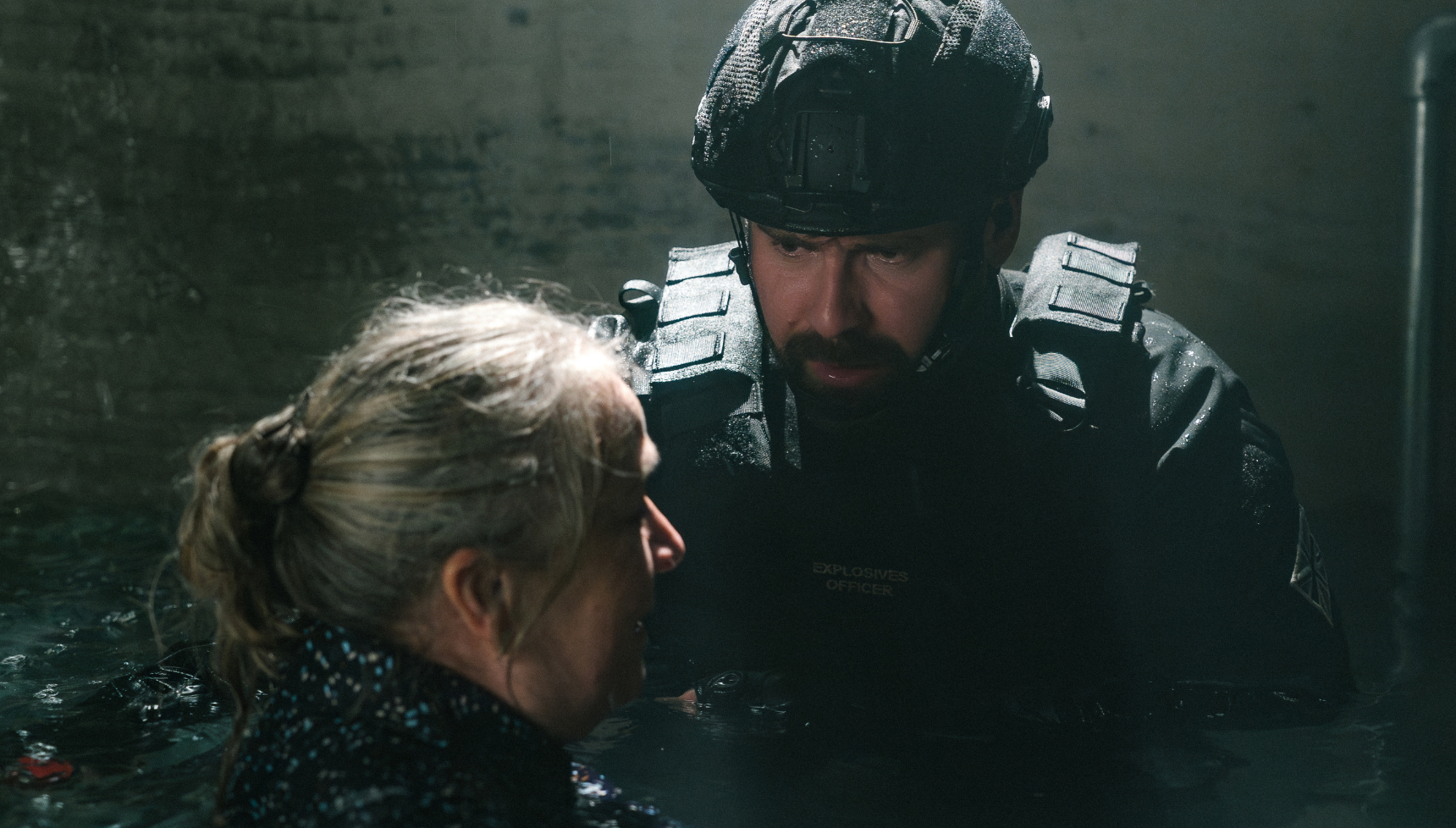 Mark Rowley and Elizabeth Allen submerged in water in Trigger Point season 3.