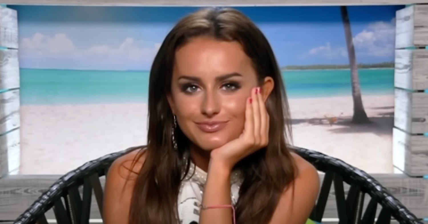 Amber Davies in Love Island beach hut, head in hand