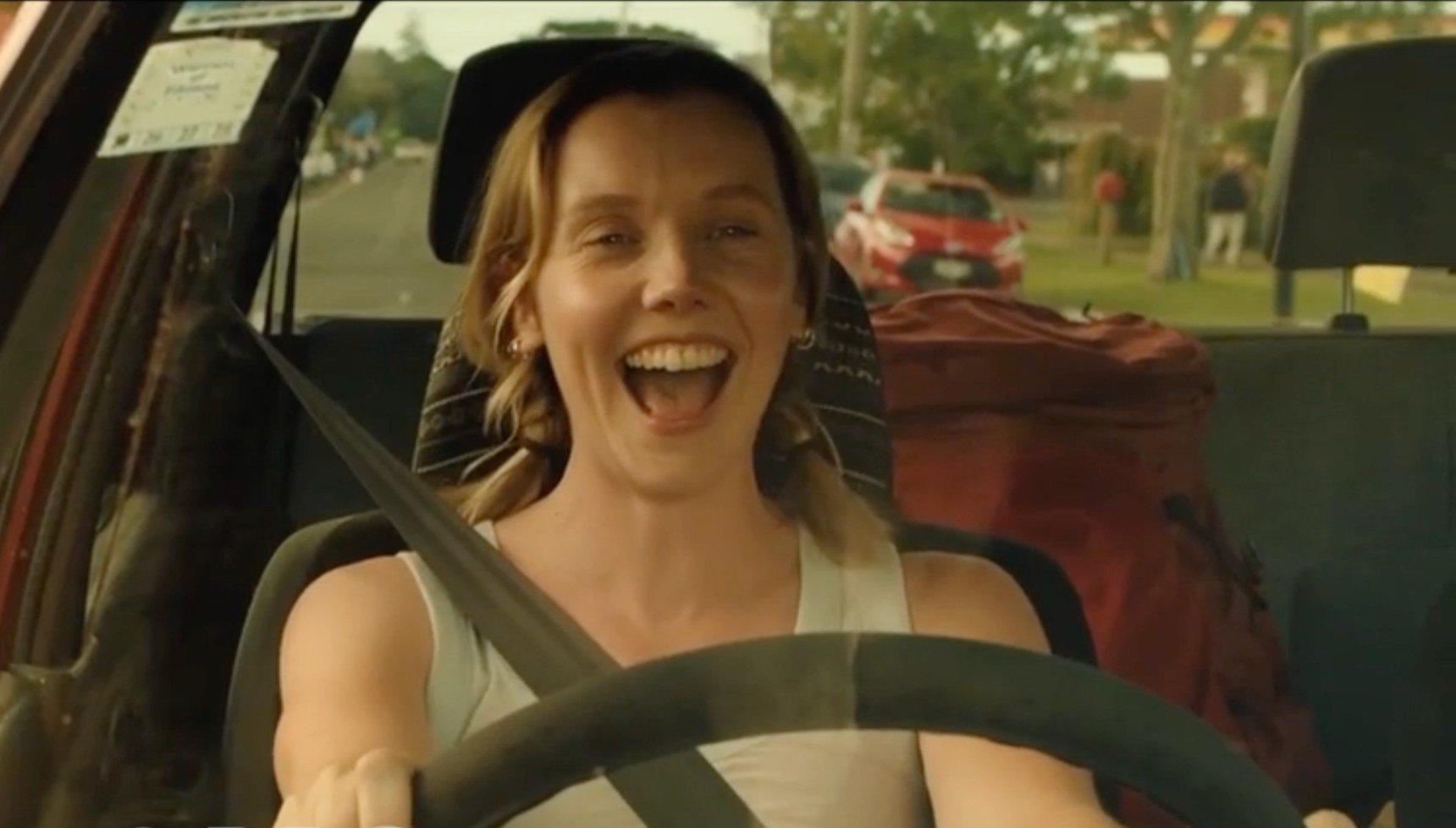 Lauren Lyle laughing as Mia in The Ridge