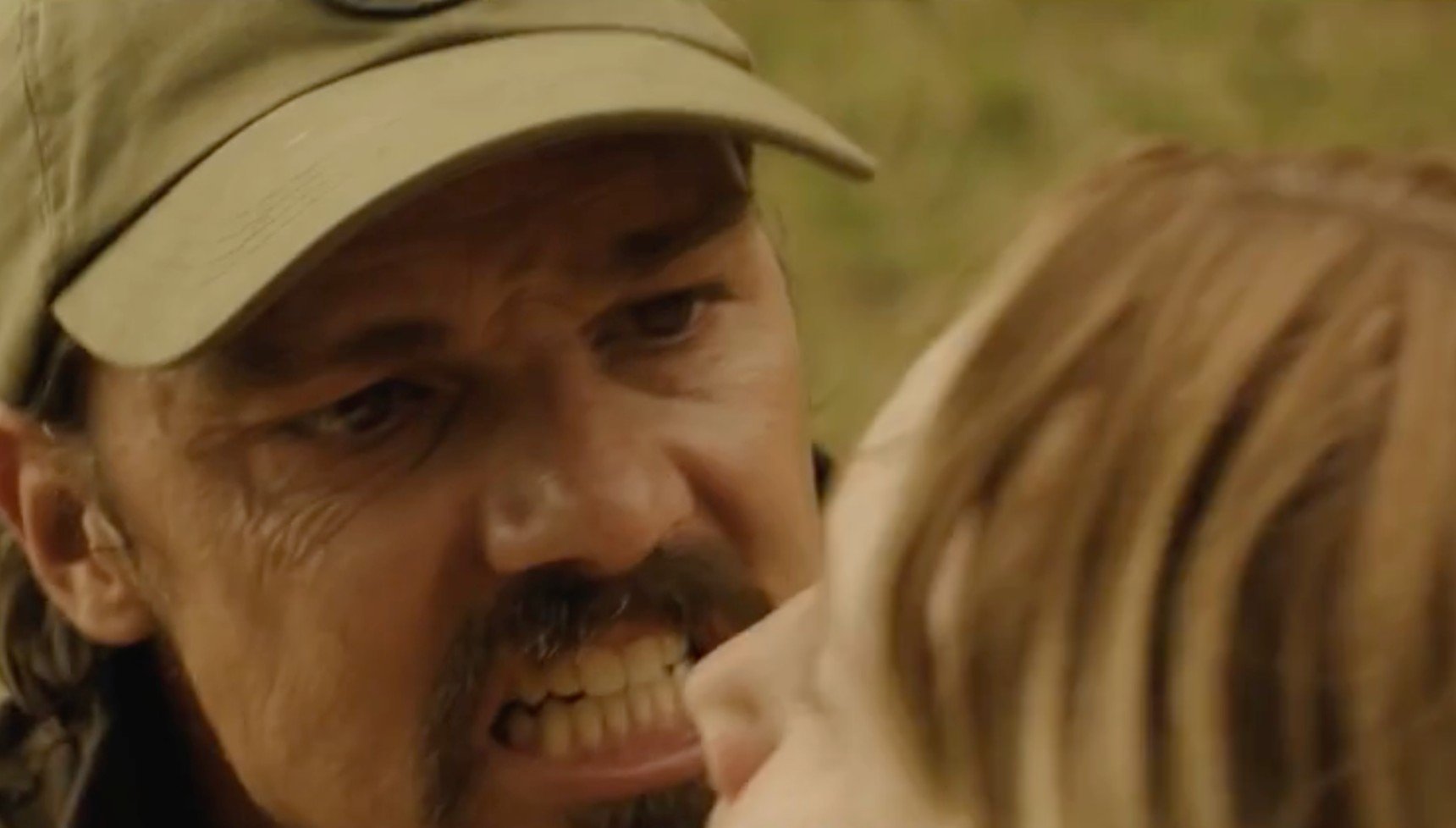 Jay Ryan baring his teeth as Ewan in The Ridge