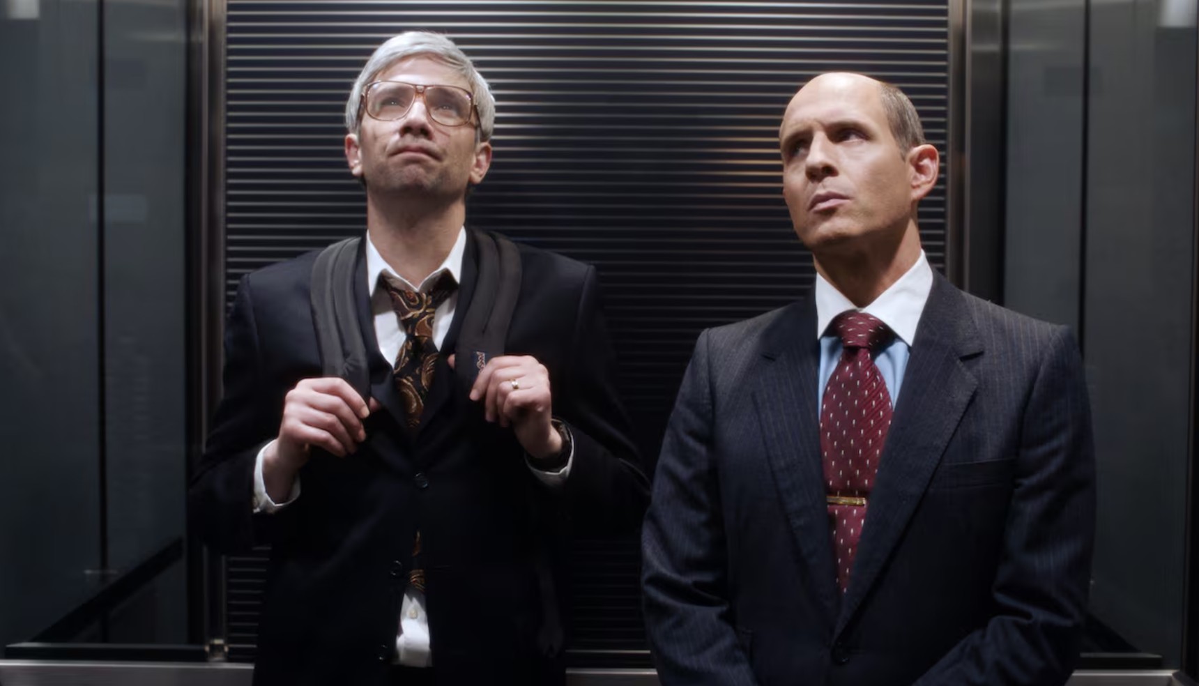 Jay Baruchel and Glenn Howerton standing in an elevator in Blackberry