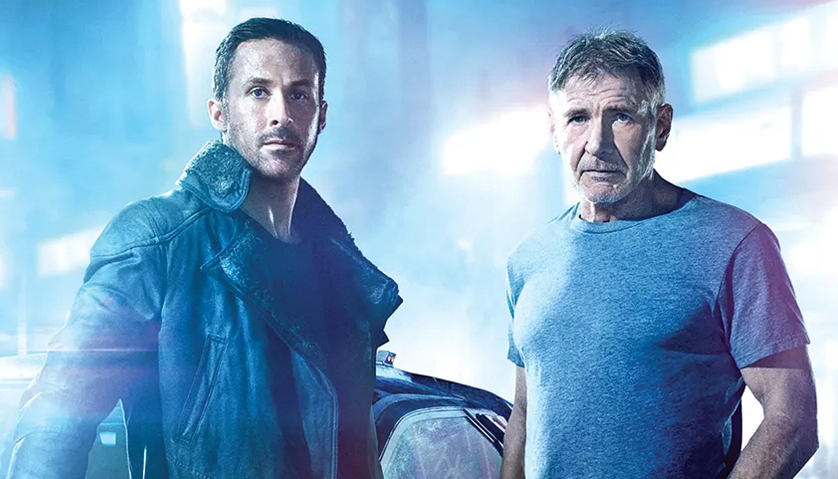 Ryan Gosling and Harrison Ford in a rainy neon environment in Blade Runner 2049