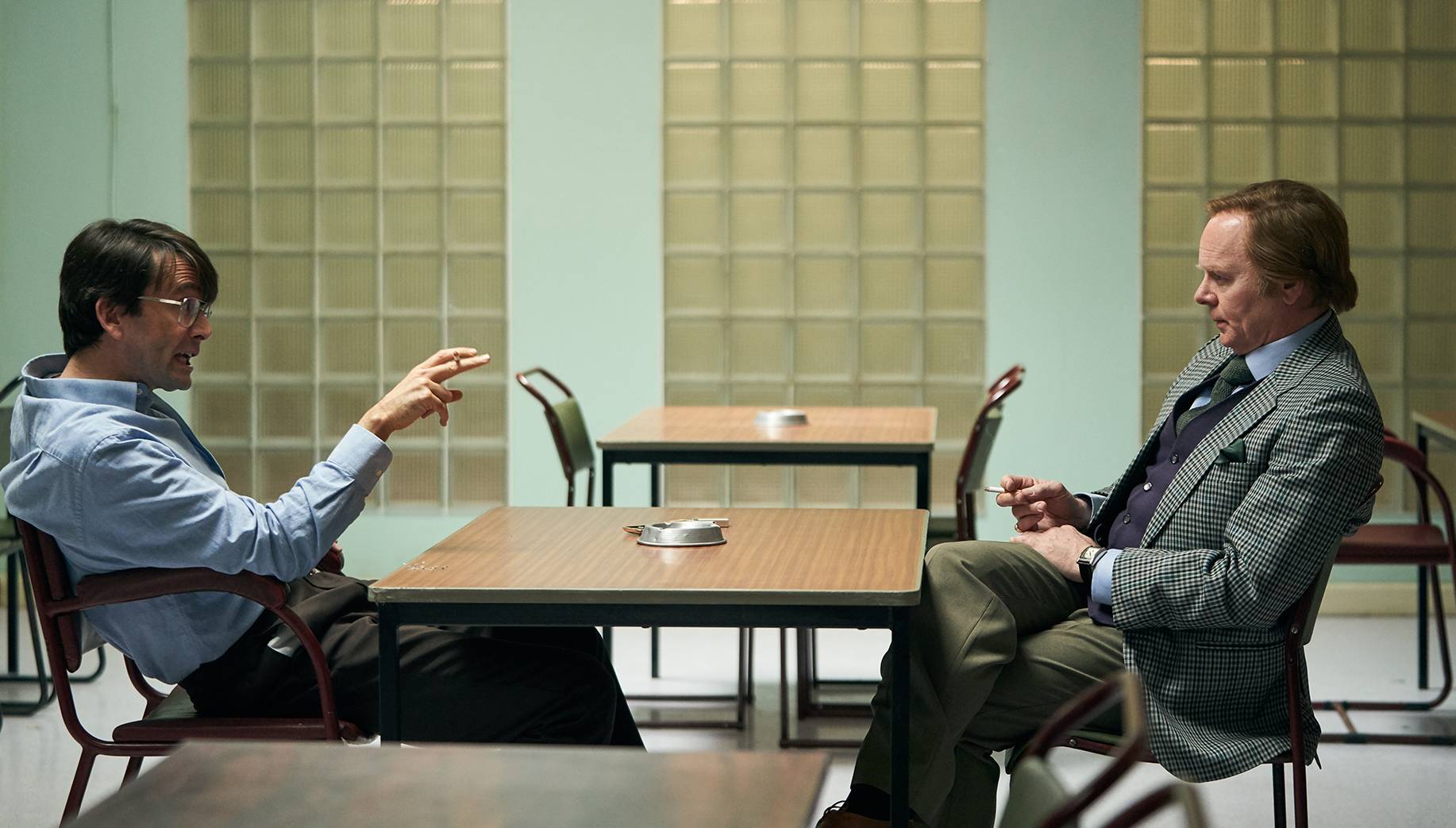 David Tennant as killer Dennis Nilsen talking to Jason Watkins as Brian Masters in Des