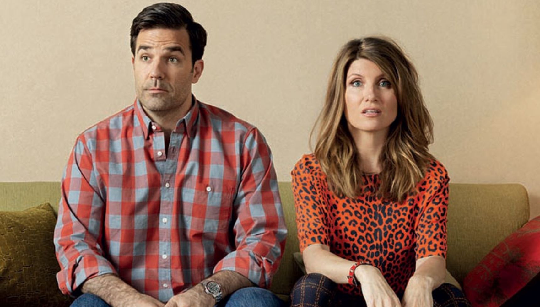 Rob Delaney and Sharon Horgan sitting next to each other in Catastrophe