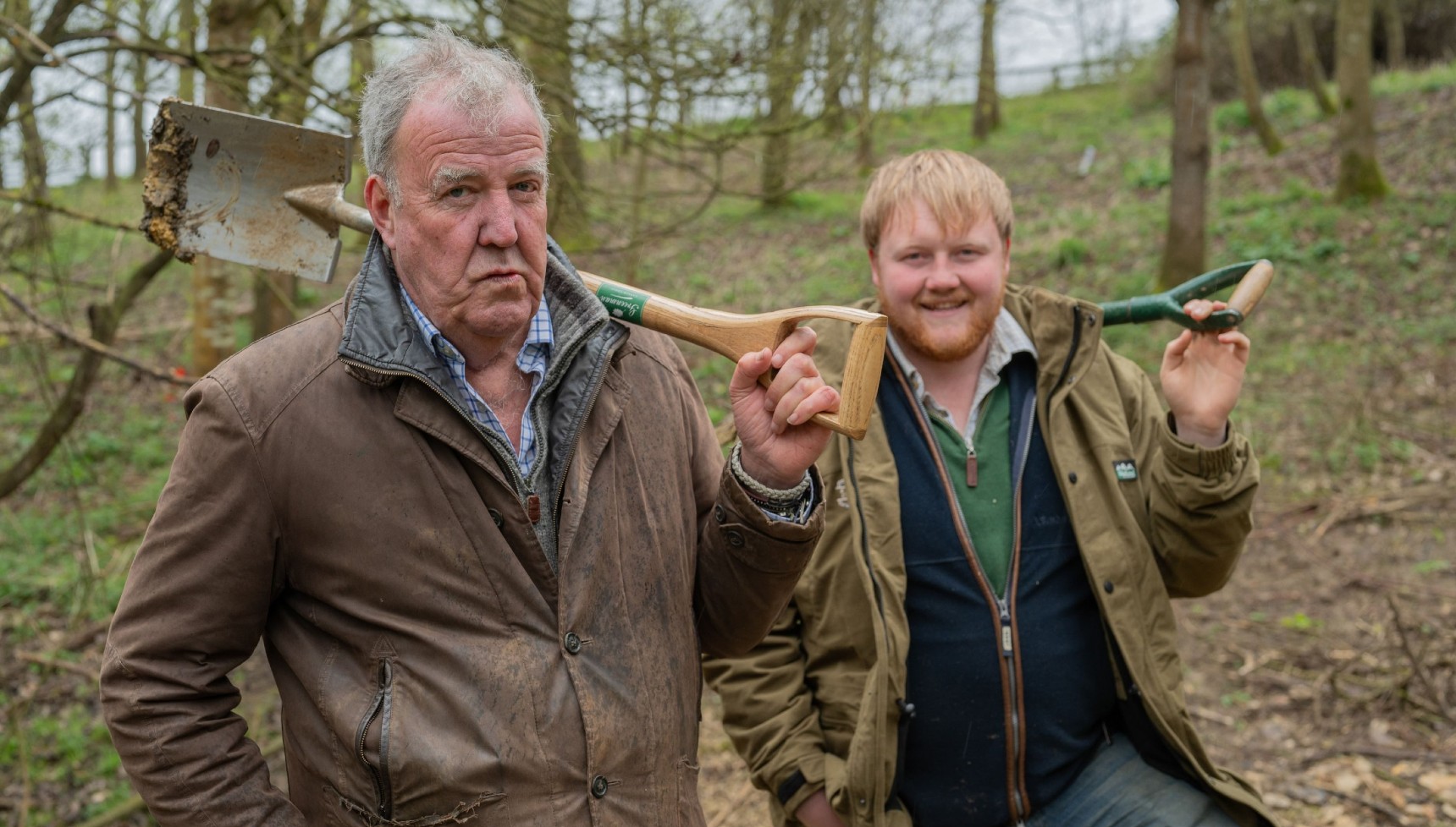 Jeremy Clarkson holding a shovel next to Kaleb Cooper