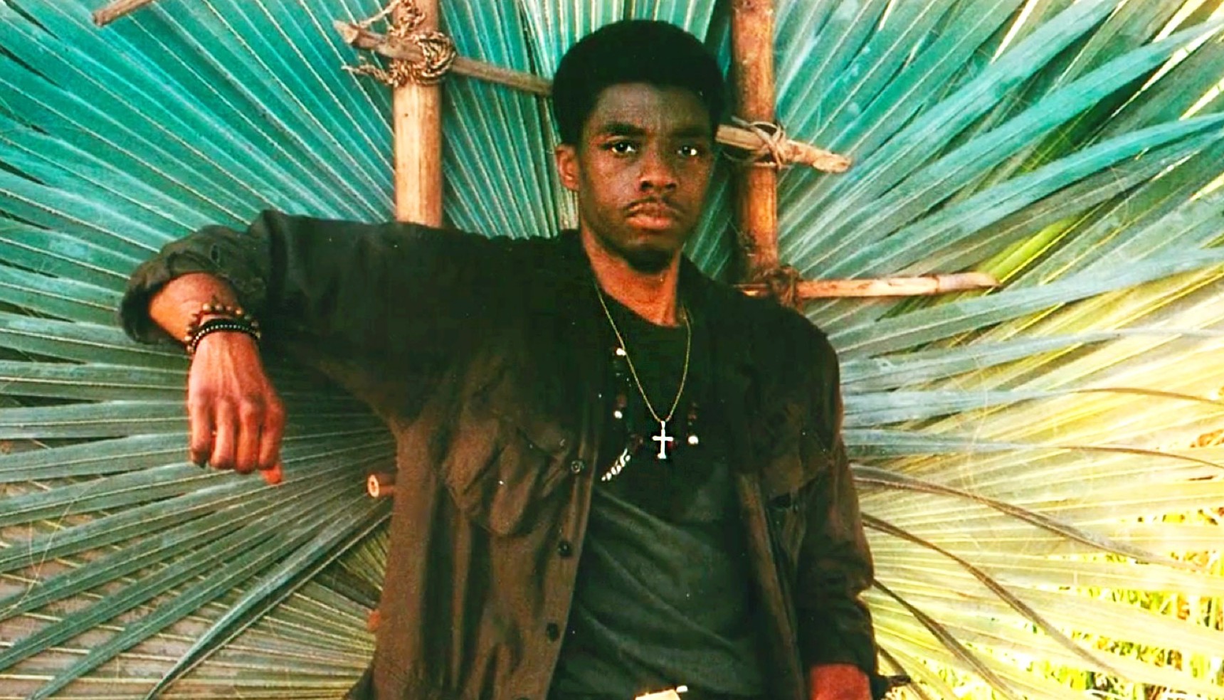 Chadwick Boseman in an army outfit in Da 5 Bloods