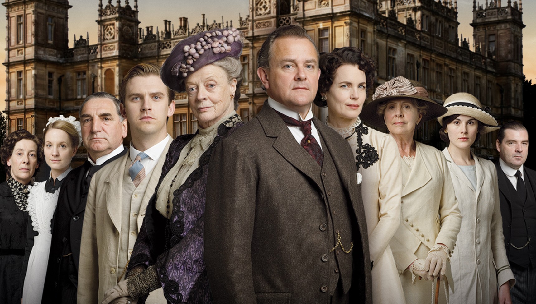 The cast of Downton Abbey in front of their estate