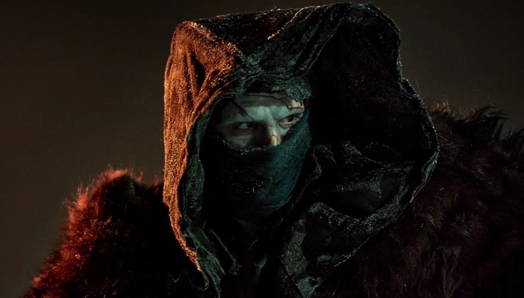 Jacob Elordi in a hooded costume as Frankenstein's monster