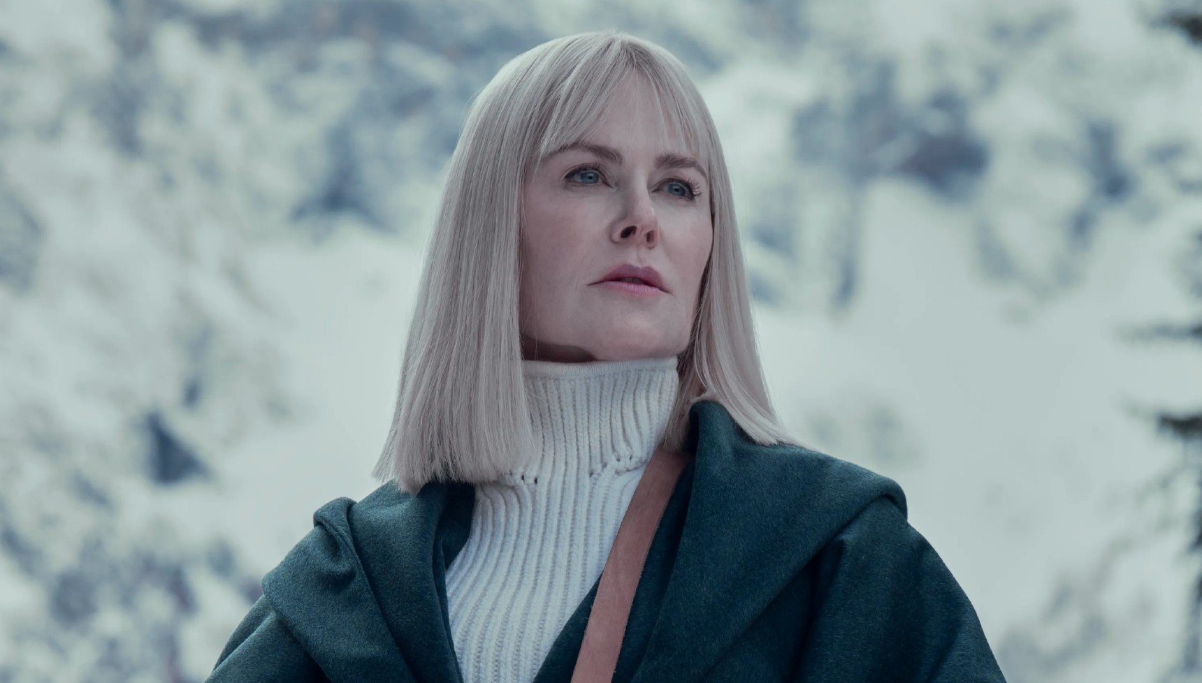 Nicole Kidman with blonde hair in a snowy forest in Nine Perfect Strangers