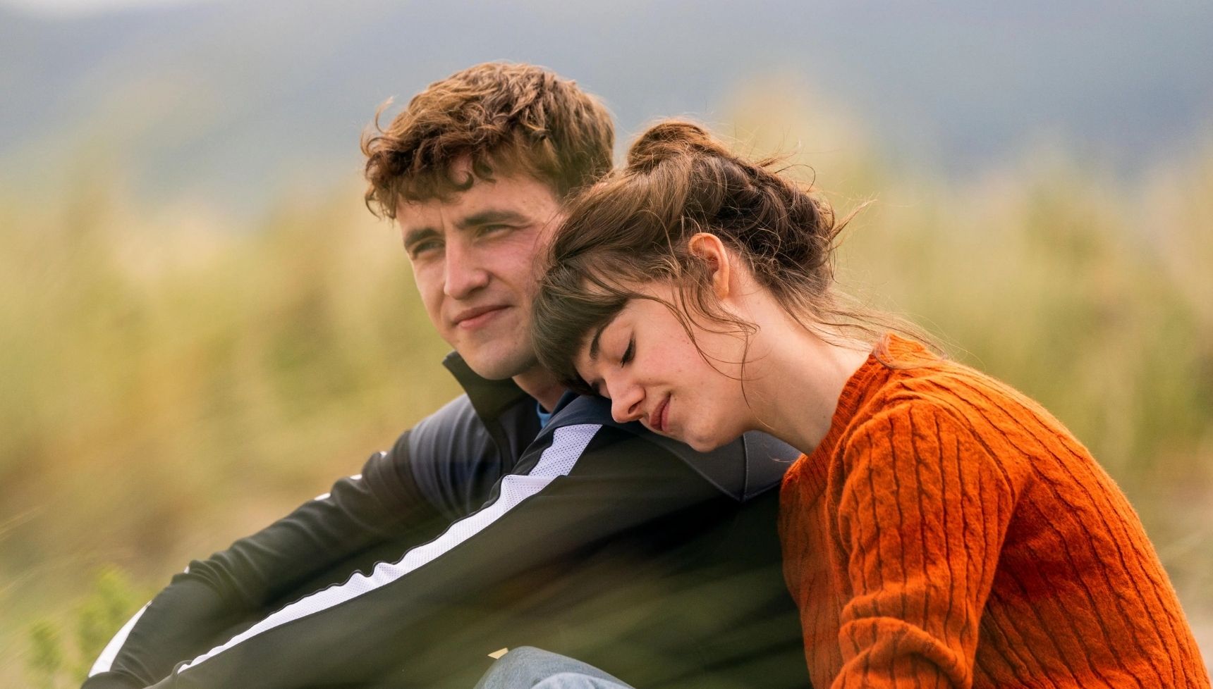 Marianne leaning on Connell's shoulder in Normal People