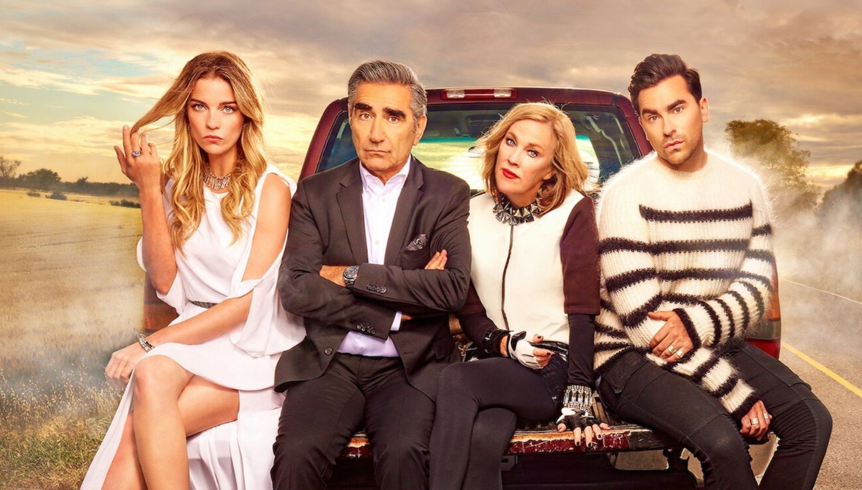 The cast of the Schitt's Creek on the back of a truck