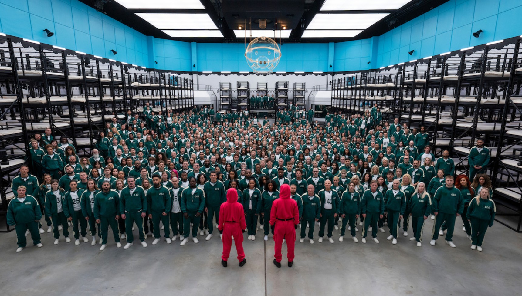 Contestants huddled together in Squid Game: The Challenge season 2