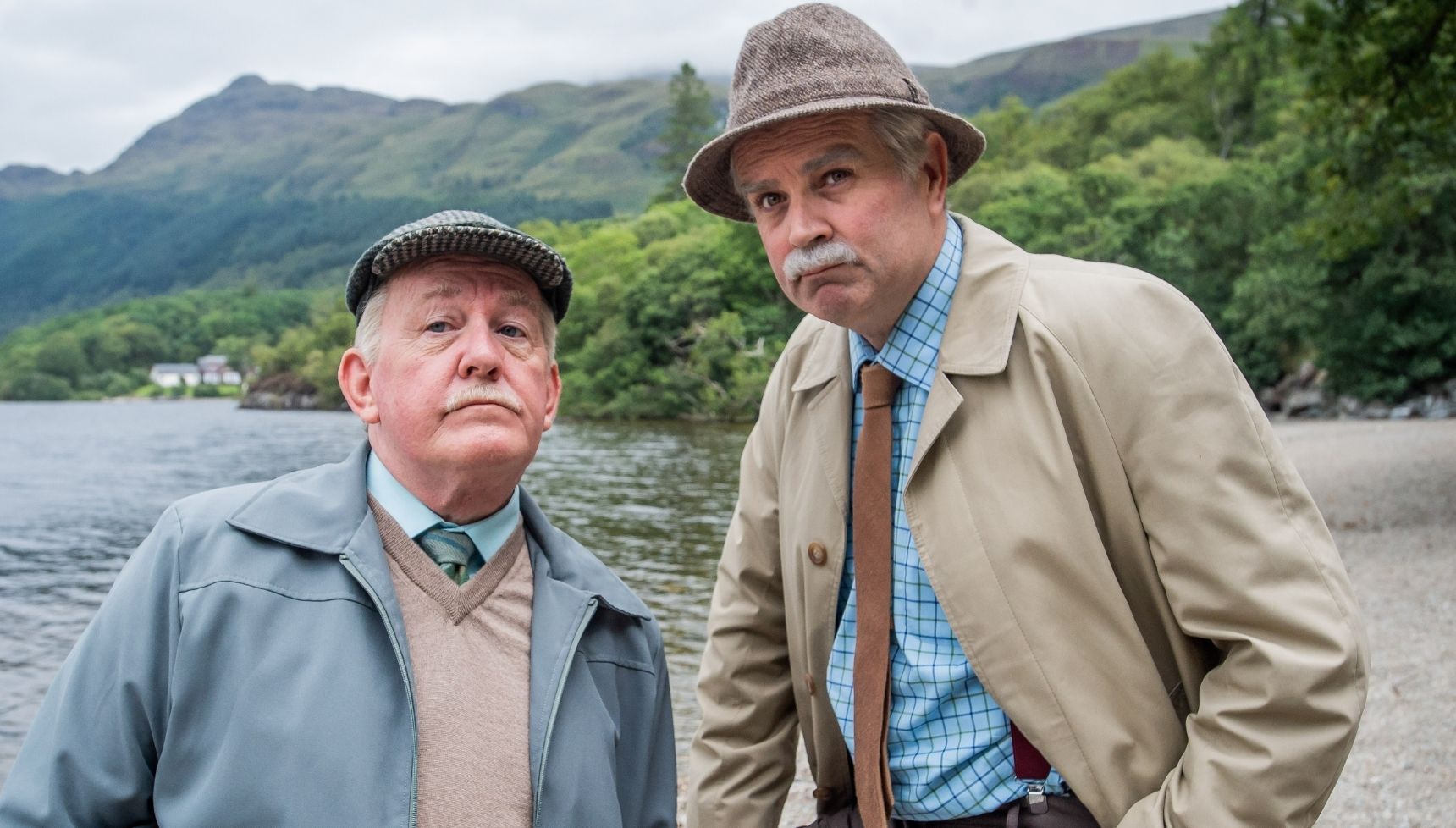 Jack and Victor standing in front of Loch Lomond in Still Game