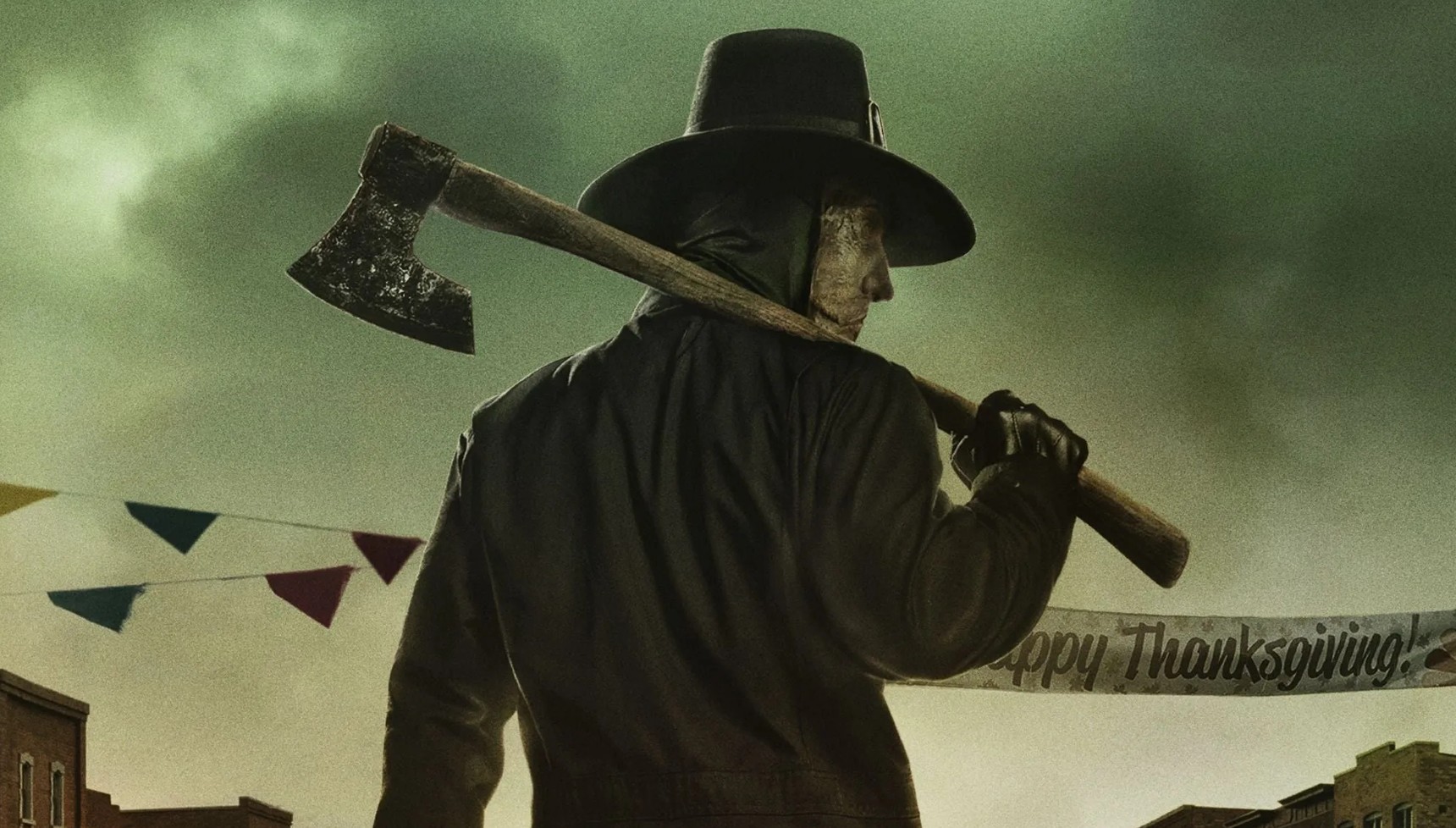 A man in a John Carver mask holding an axe in Thanksgiving