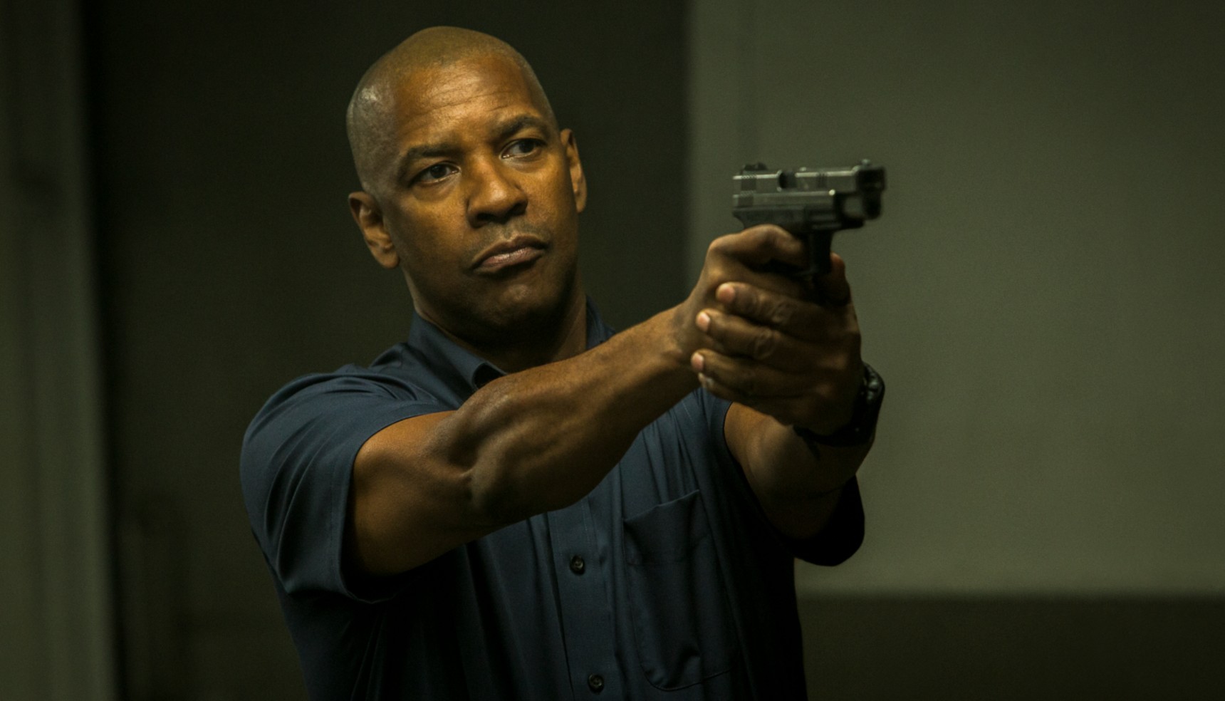 Denzel Washington holding a gun in The Equalizer
