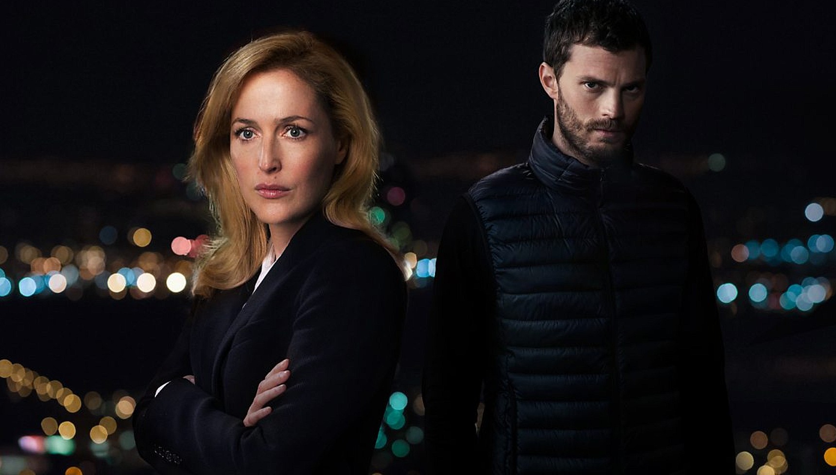 Gillian Anderson and Jamie Dornan against the backdrop of a night sky in The Fall