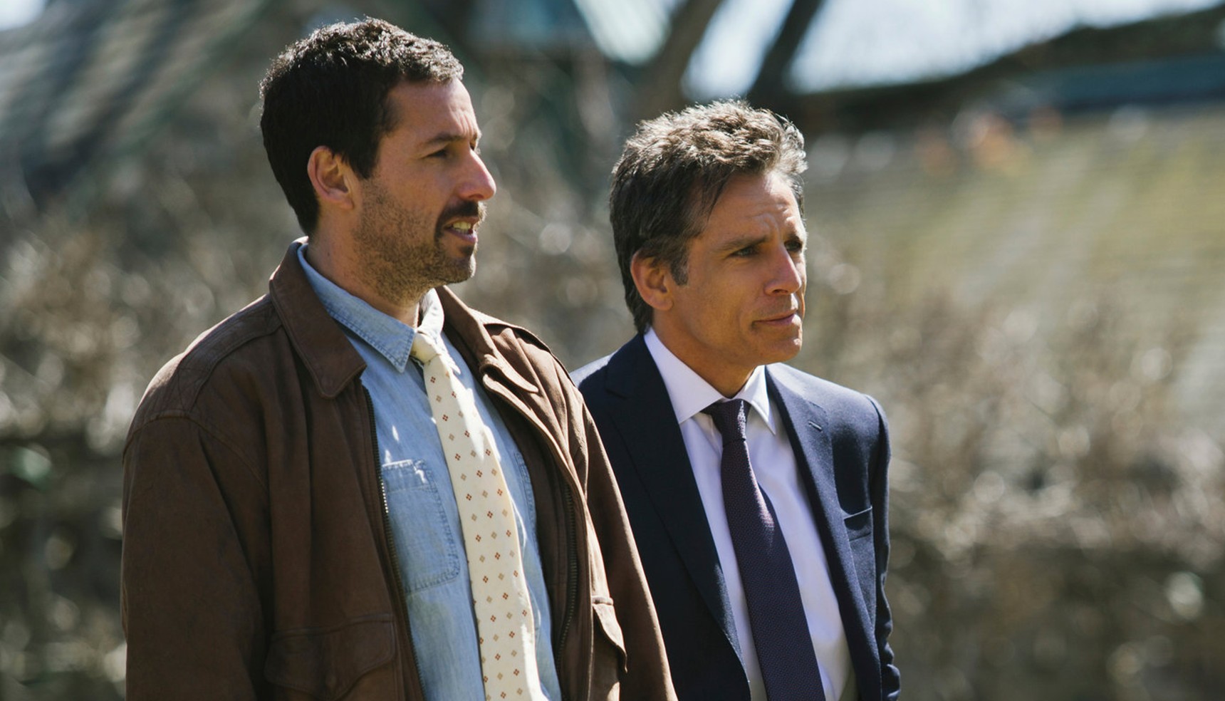 Adam Sandler and Ben Stiller staring off into the distance in The Meyerowitz Stories