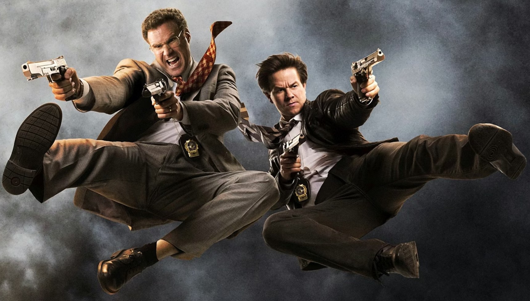 Will Ferrell and Mark Wahlberg jumping in the air while holding guns