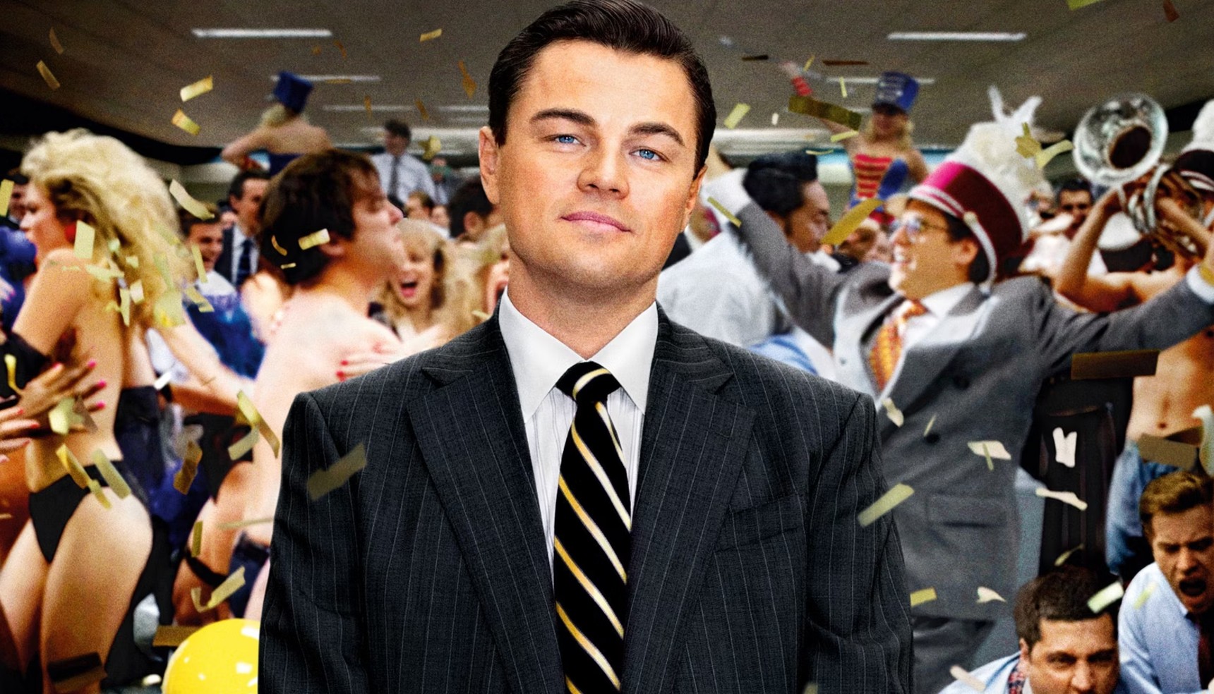 Leonardo DiCaprio surrounded by people partying in The Wolf of Wall Street