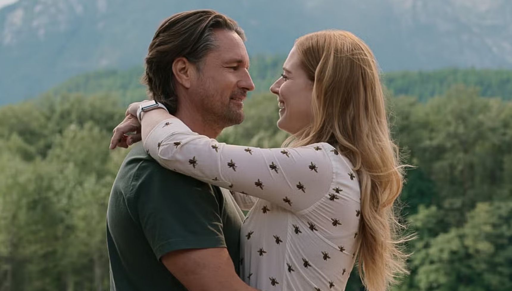 Alexandra Breckenridge and Martin Henderson hugging each other in Virgin River