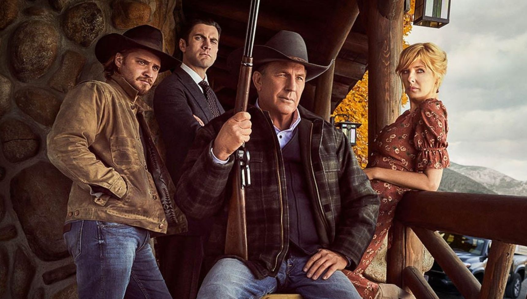 Kayce, Jamie, John, and Beth Dutton posing with a gun on the Yellowstone poster