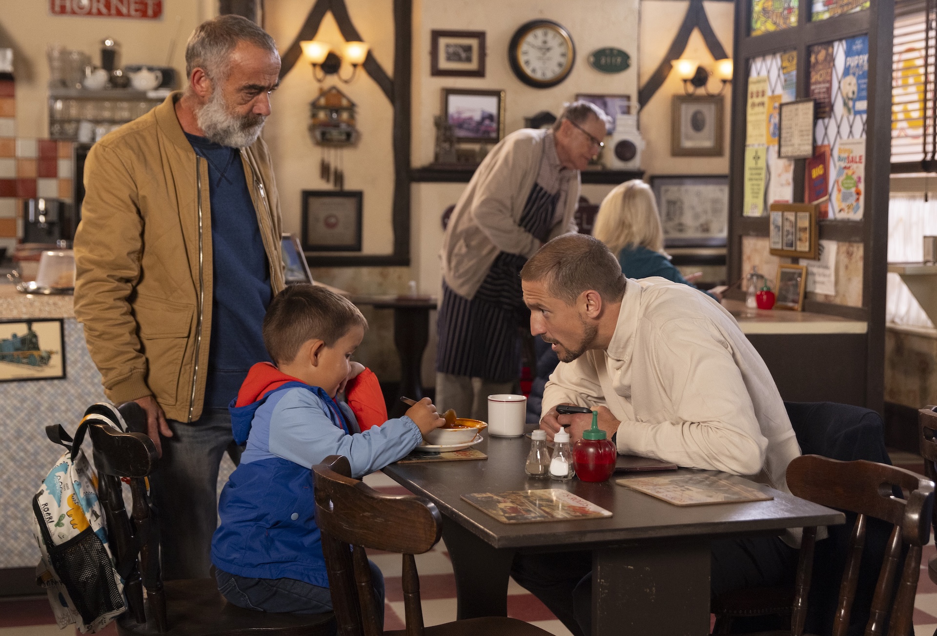 Kevin and Carl are talking with Alfie