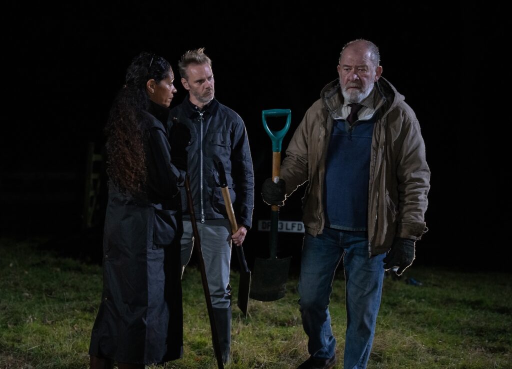 Celia and Ray look on at Bear in Emmerdale