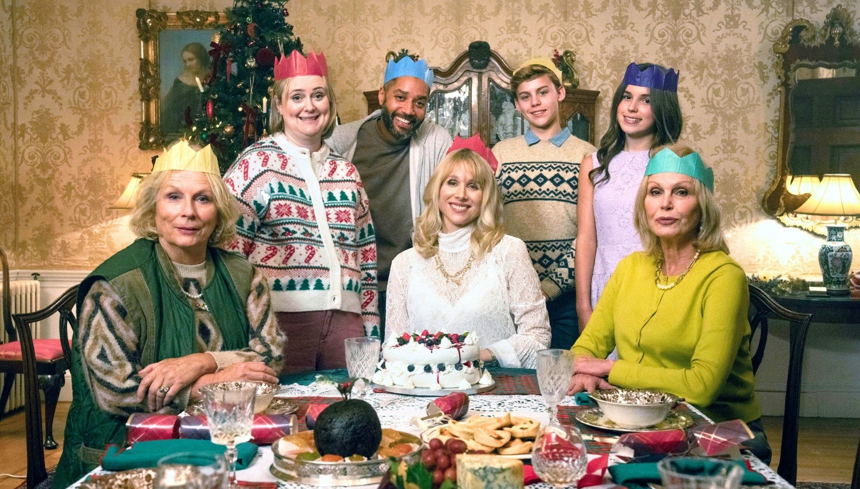 The Amandaland cast, including Jennifer Saunders, sitting at a table having Christmas lunch